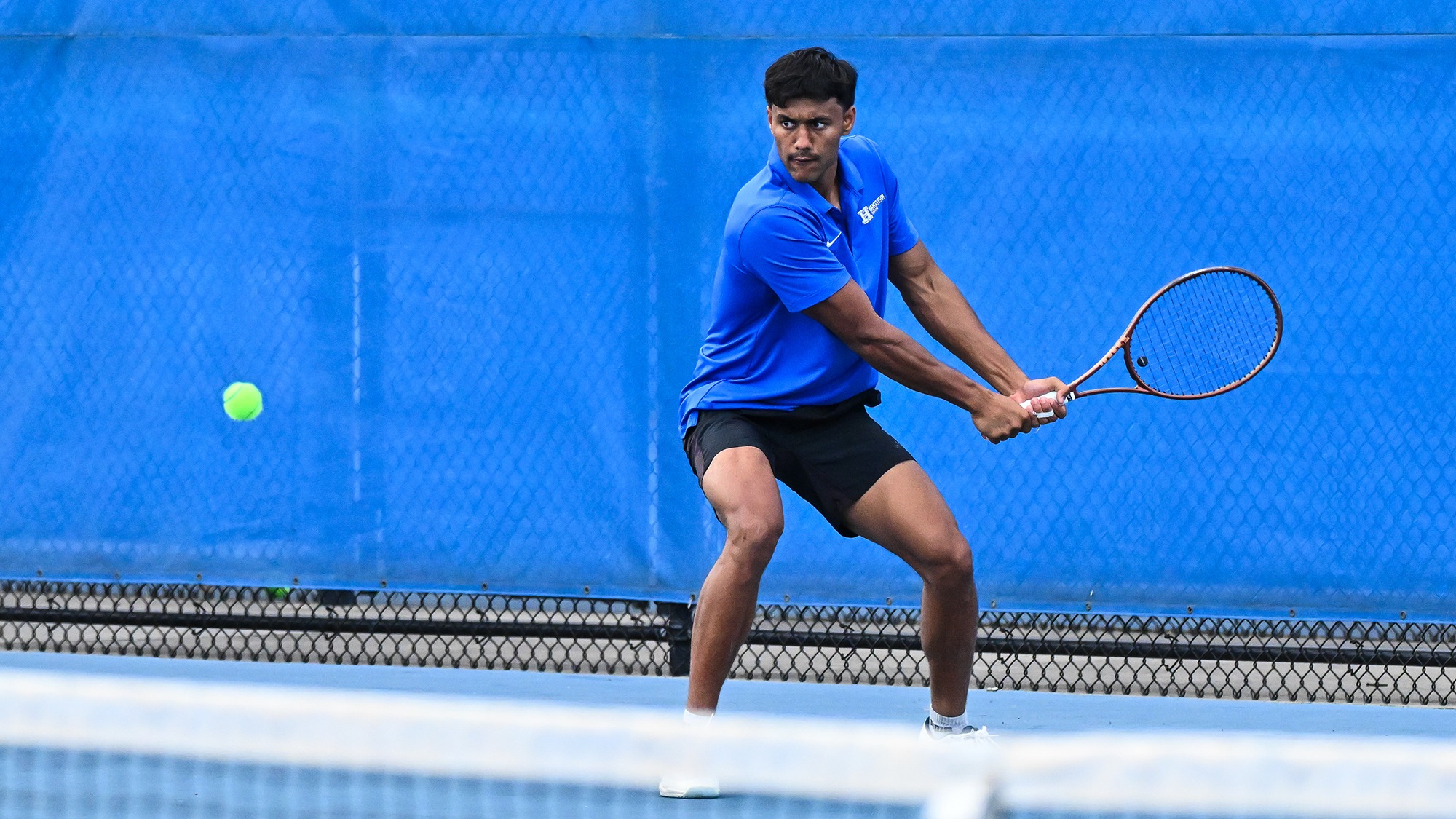 Tarun Korwar prepares to hit a backhand return during tennis practice in September 2025