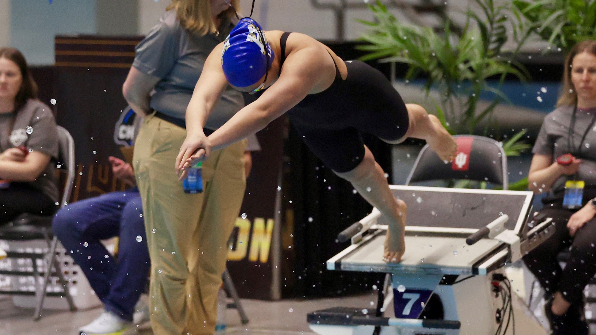 Chloe Lan jumps off the starting block during the women's 200 free relay at the 2026 NCAA Swimming and Diving Championships