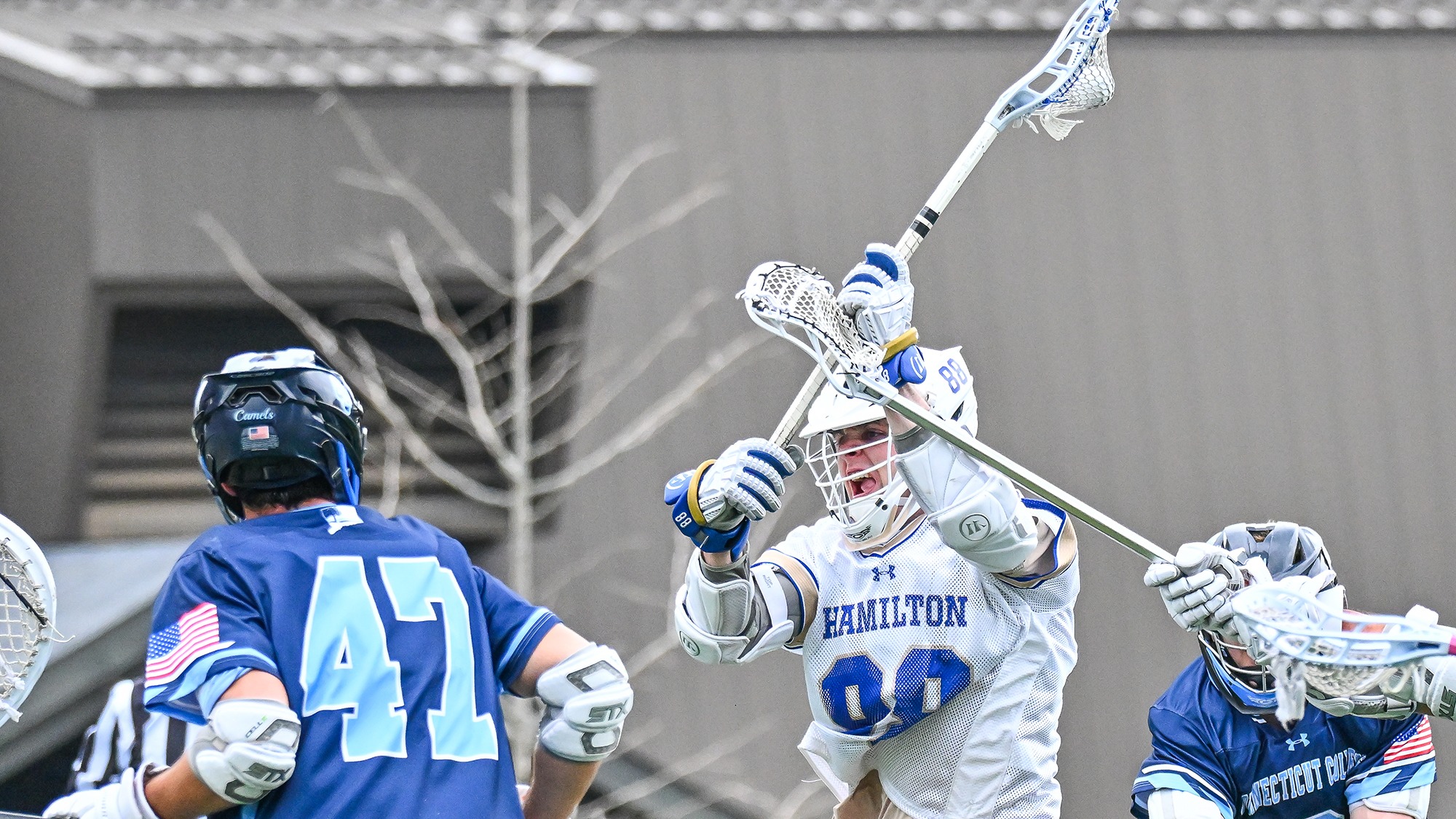Thomas Healy takes a shot in a men's lacrosse game against Connecticut College