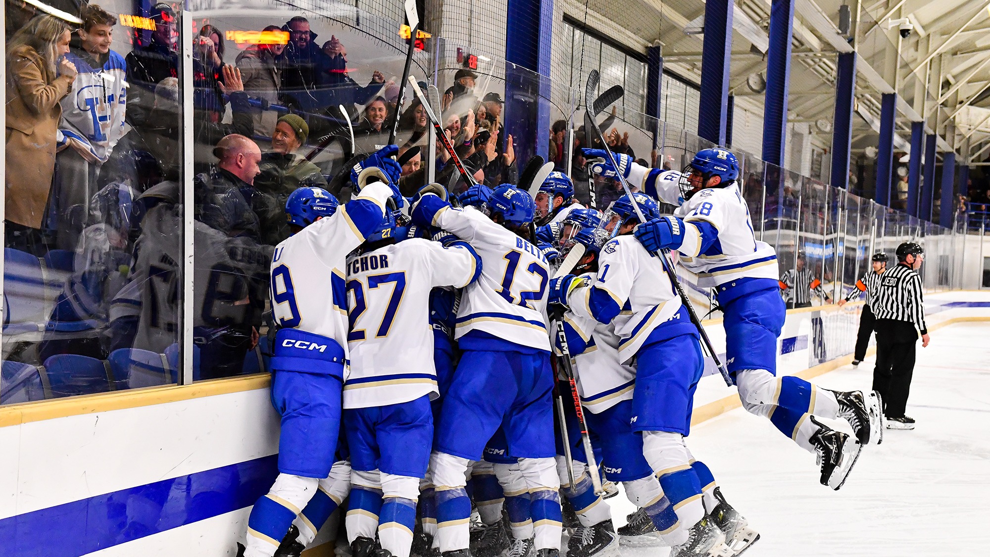 Men's Hockey players celebrate their 2026 NCAA quarterfinal win over Norwich