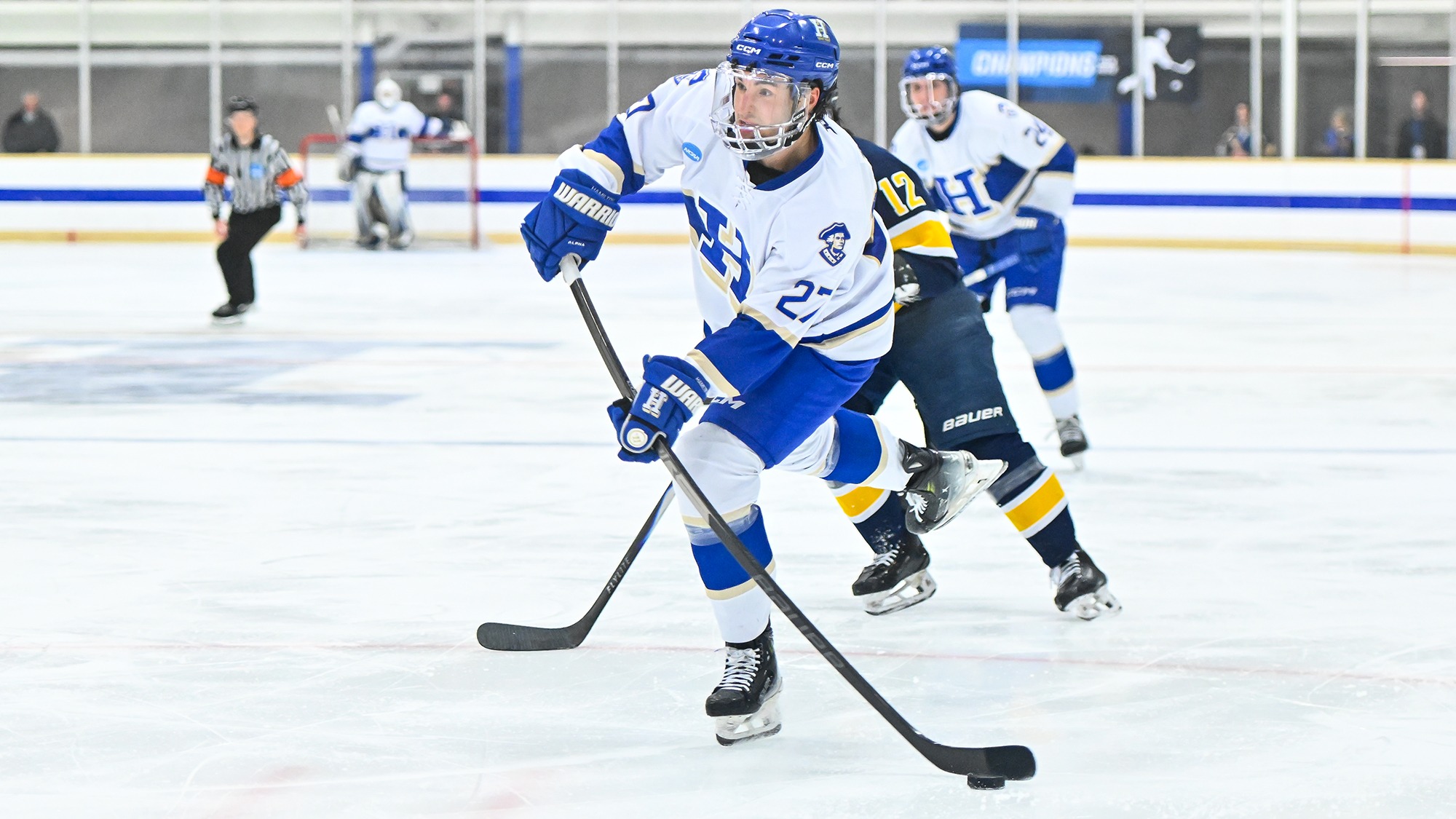 Luke Tchor shoots the puck against Neumann in the 2026 NCAA men's hockey semifinals