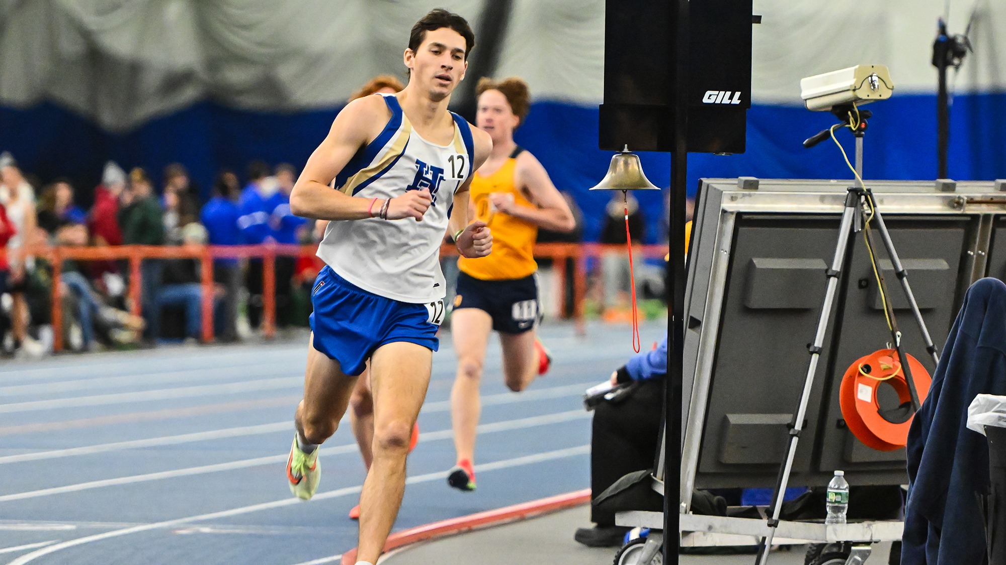 Drew Richardson rounds a turn in the mile run at the 2026 Utica Winter Opener