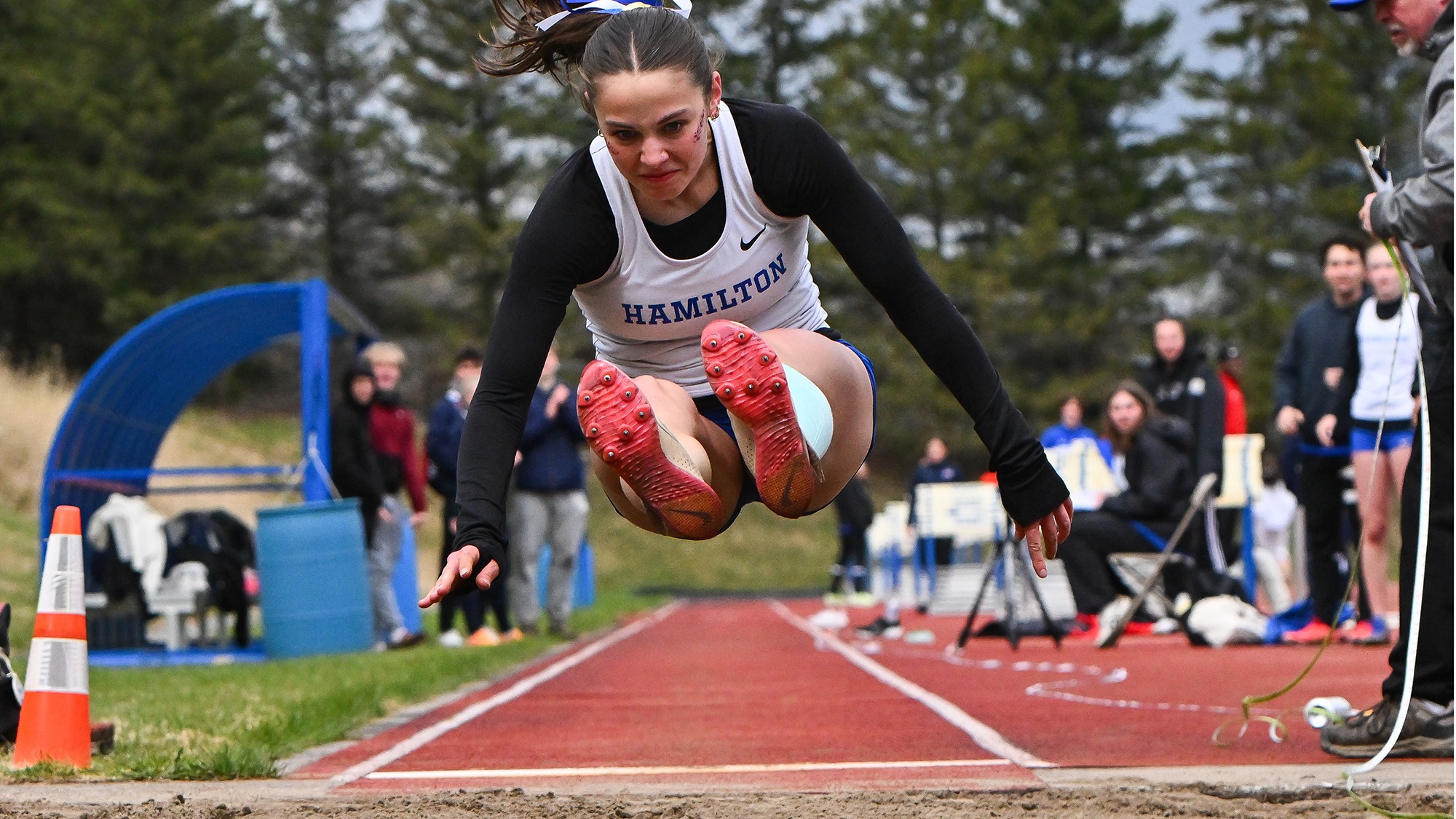 Emmeline Stoetzel flies through the air in the long jump at the 2026 Hamilton Outdoor Track and Field Invitational
