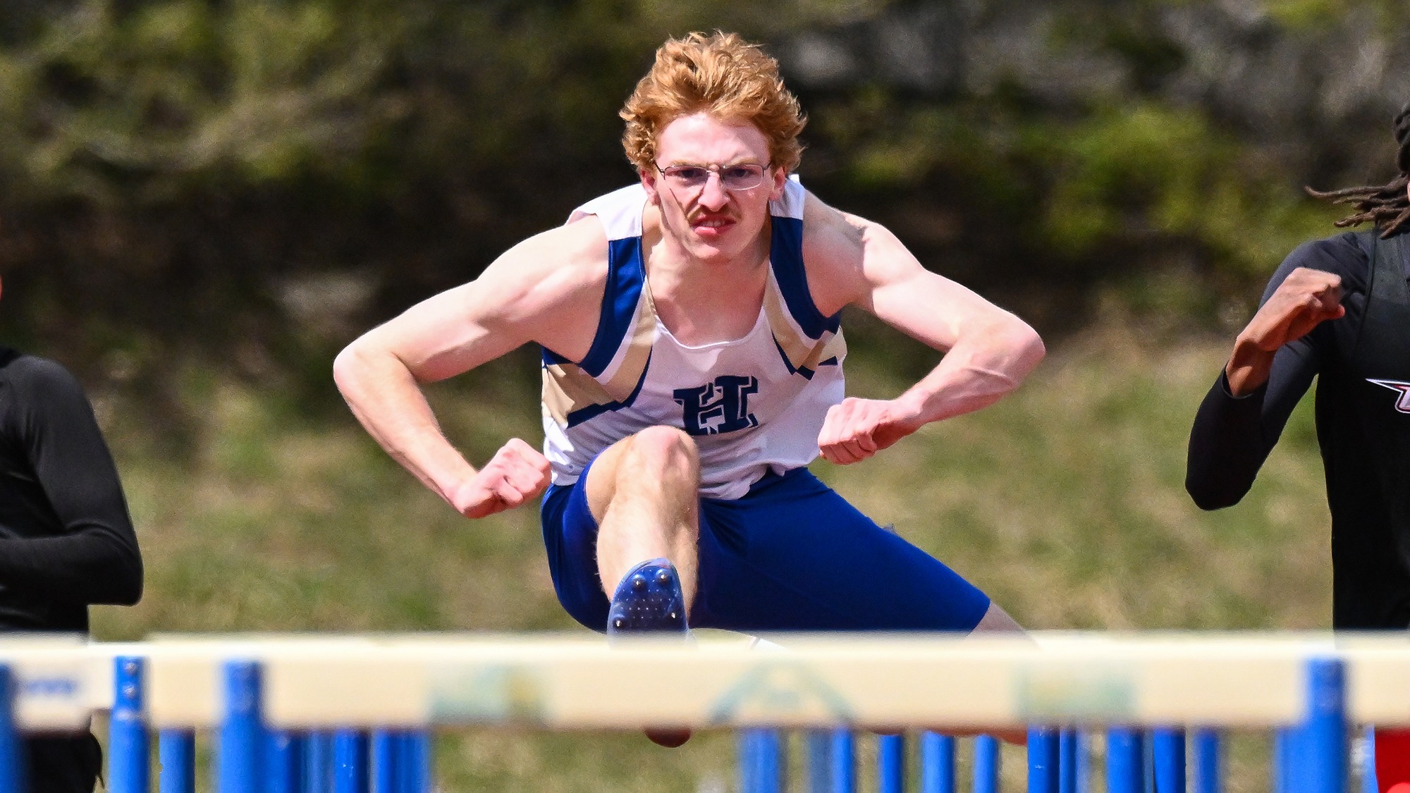 Ian Fisher jumps over a hurdle in the 110-meter hurdles during the 2026 Hamilton Outdoor Track and Field Invitational