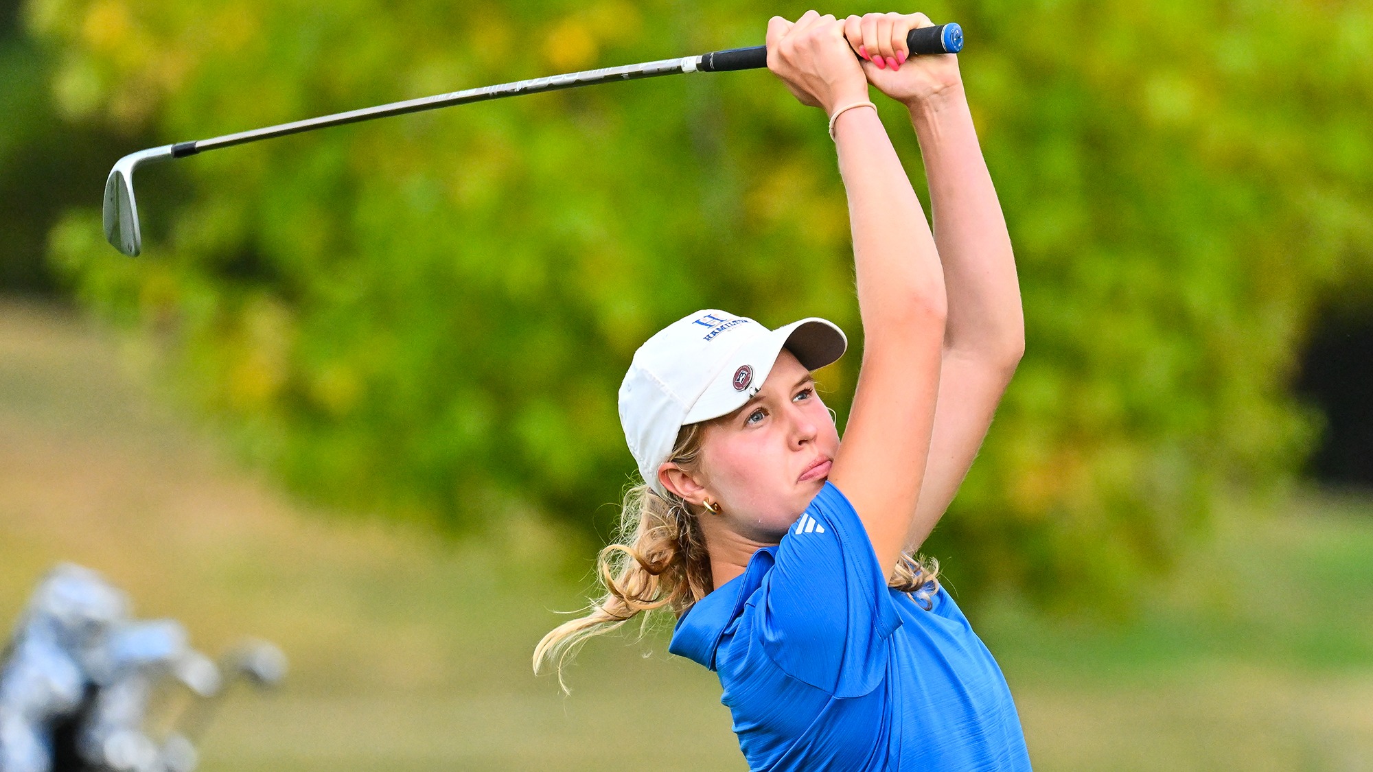 Peyton Sichol follows through on her iron shot during women's golf practice in September 2025