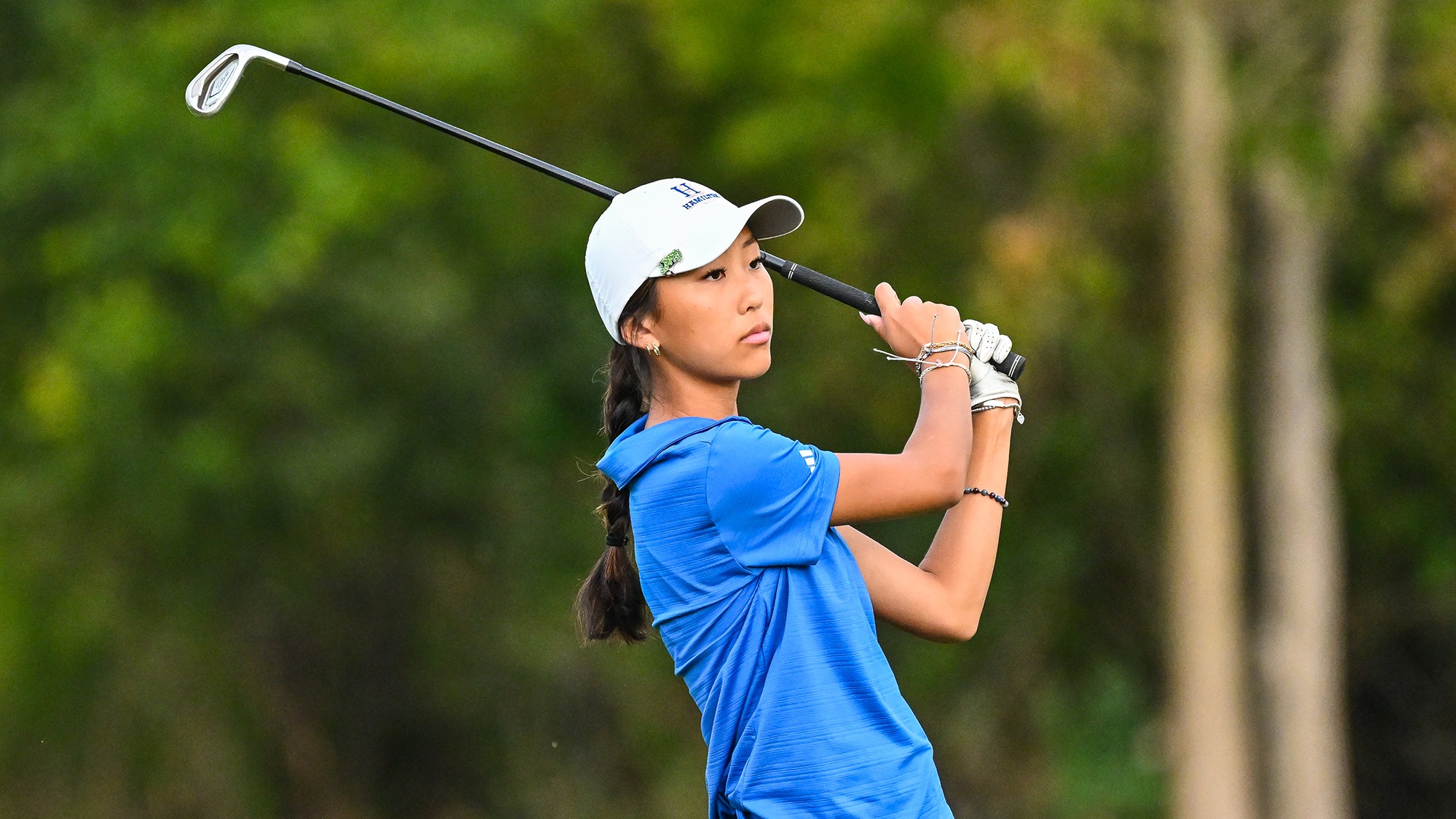 Aubrey Lee watches her iron shot on the driving range at practice in September 2025