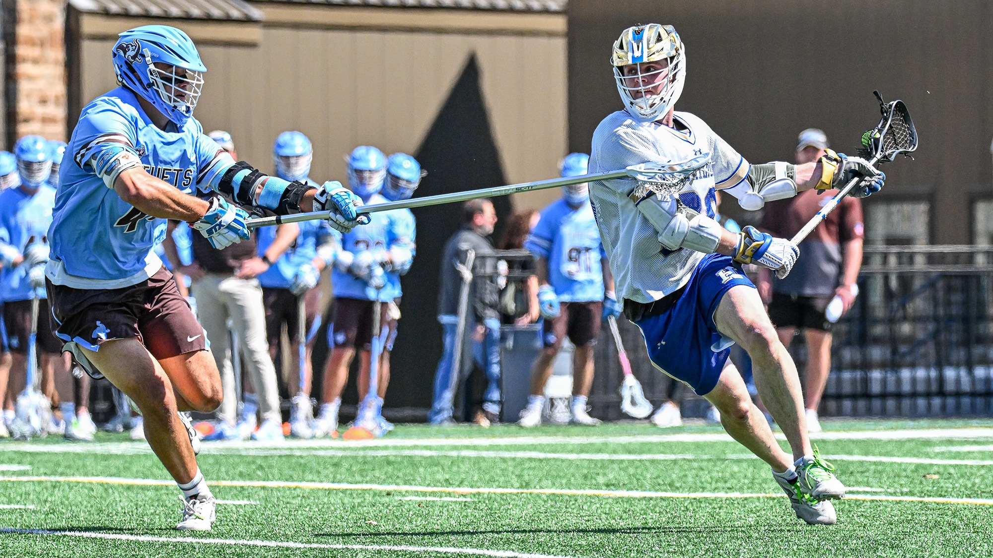 Thomas Healy takes a shot in a men's lacrosse game against Tufts