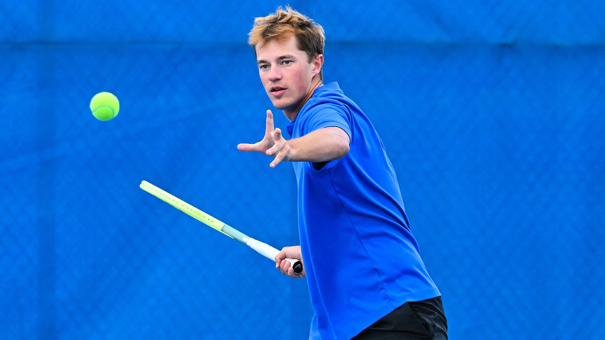 Anson Anderson hits a forehand return during men's tennis practice in September 2025
