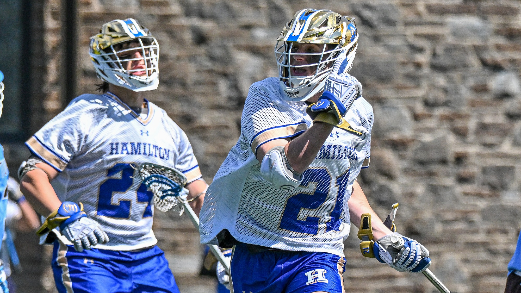Men's Lacrosse players celebrate a goal in a 2026 game against Tufts