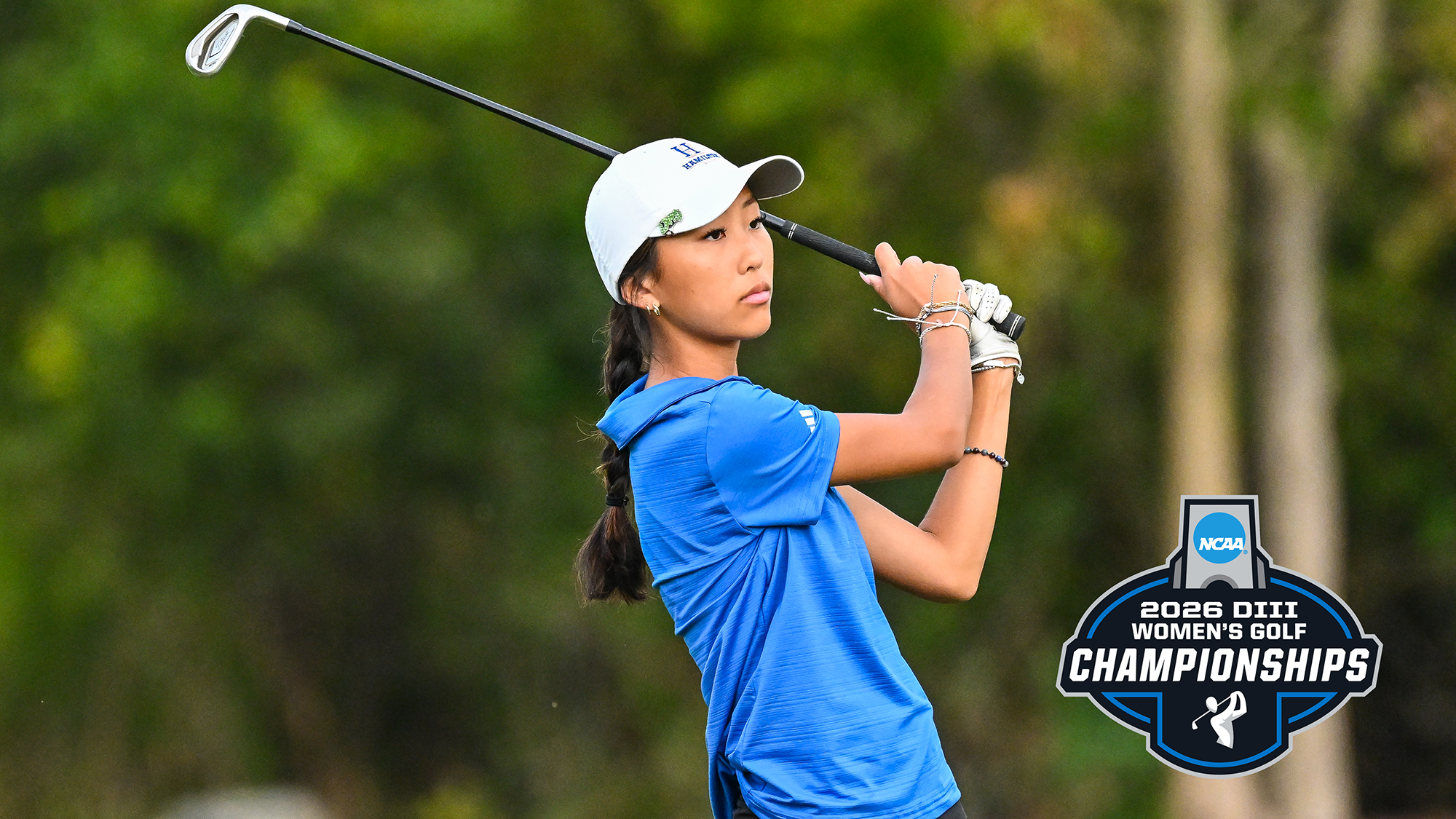 Aubrey Lee watches her iron shot on the range during women's golf practice in September 2025