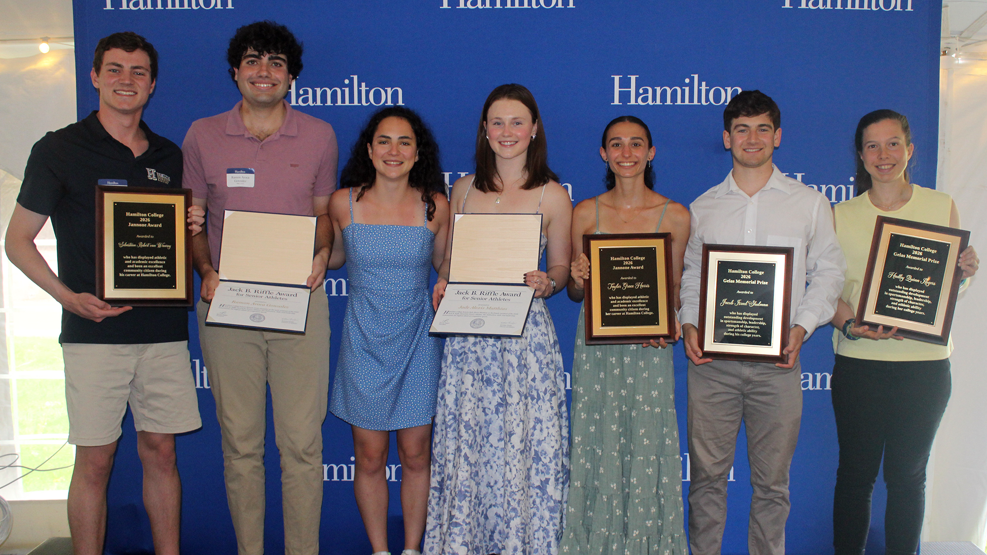 2026 Senior Varsity Athlete Award winners strike a pose on the stage after the Riffle Celebration