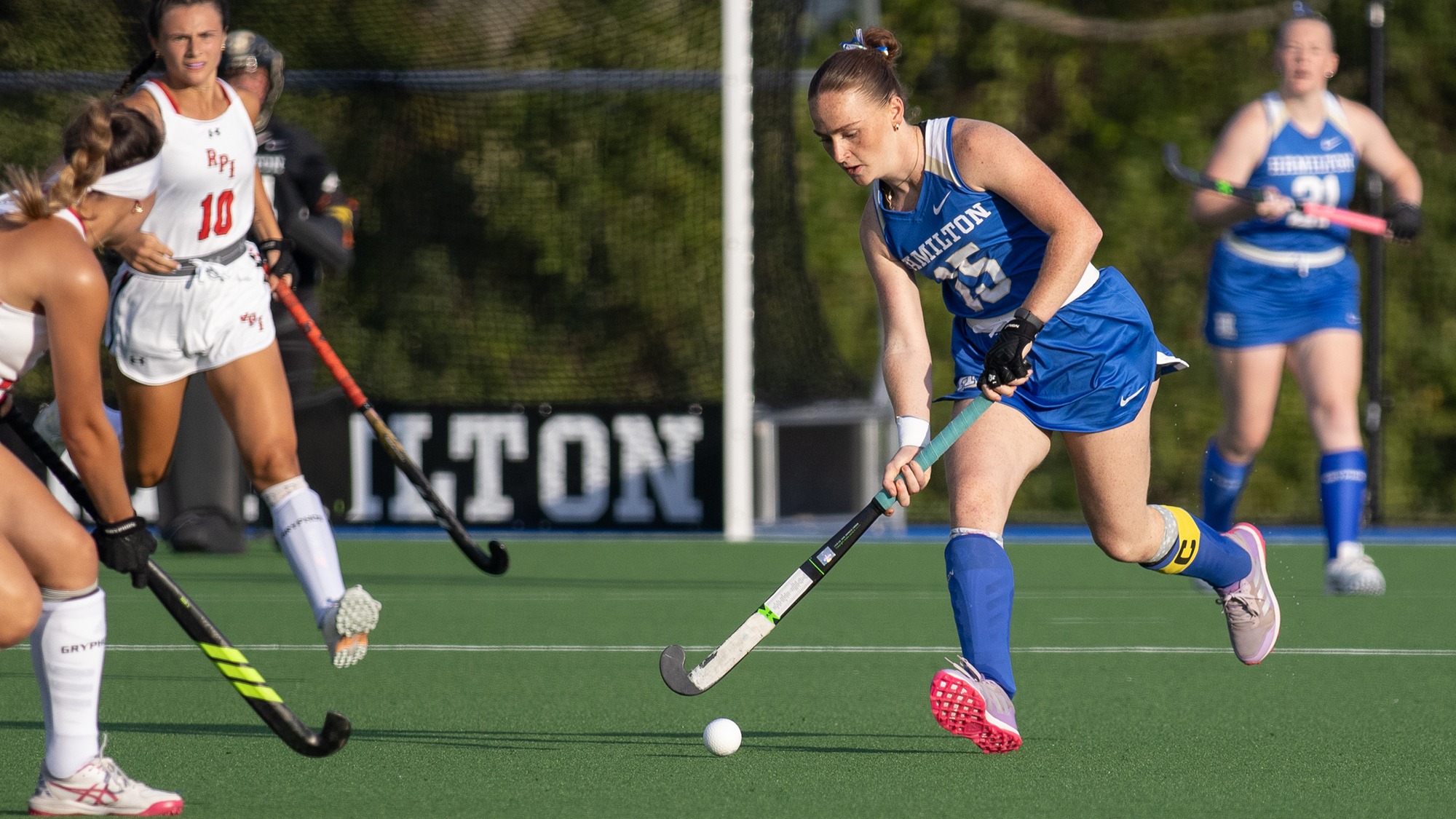 Isabelle Nahon takes the field hockey ball up the field against RPI