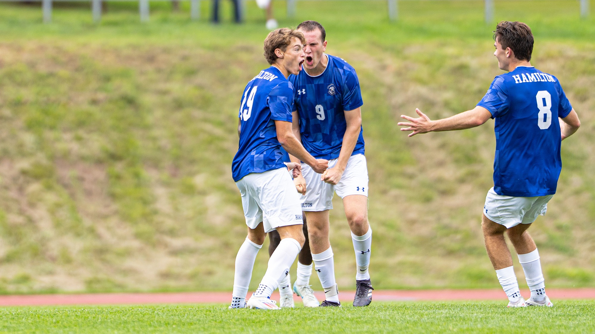 Men's Soccer players celebrate a goal in a preseason scrimmage