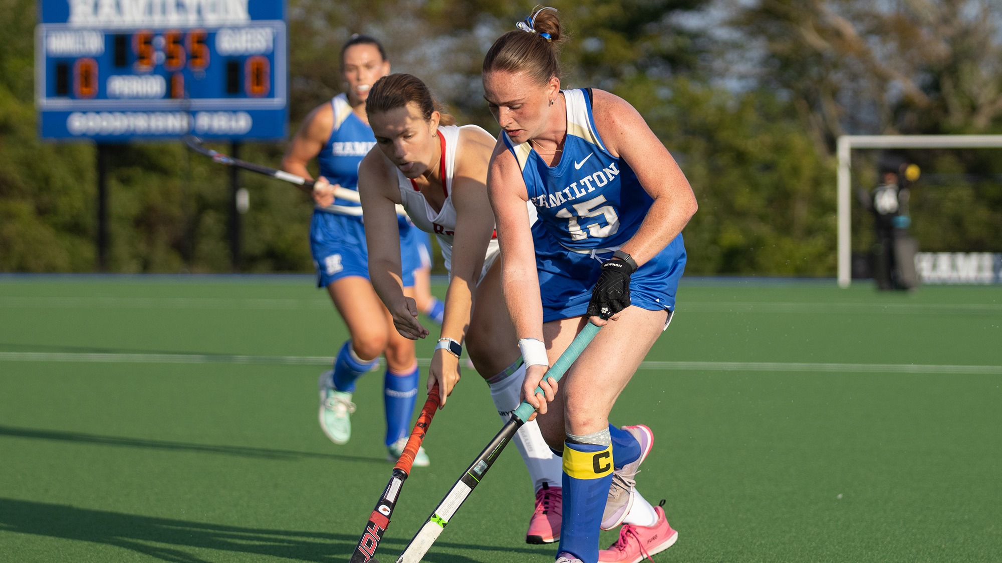 Isabelle Nahon fights off an RPI field hockey defender for possession of the ball