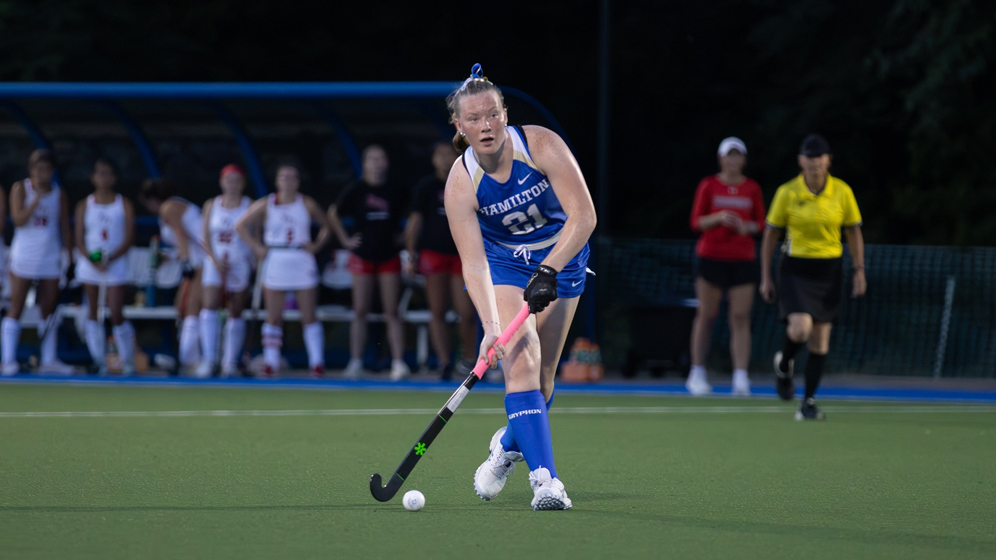 Morgan Clarke looks up for a field hockey teammate to pass to against RPI