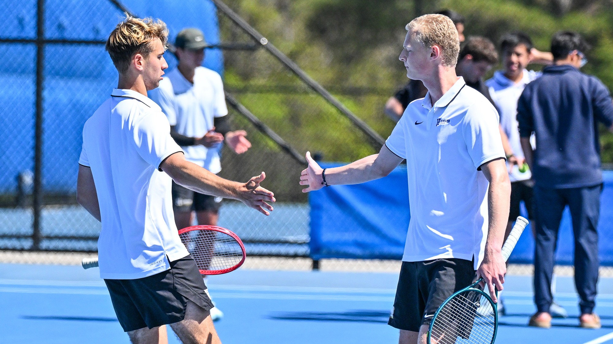 Men's Tennis doubles partners Alexei Katelevsky and Filip Moller congratulate each other after a point