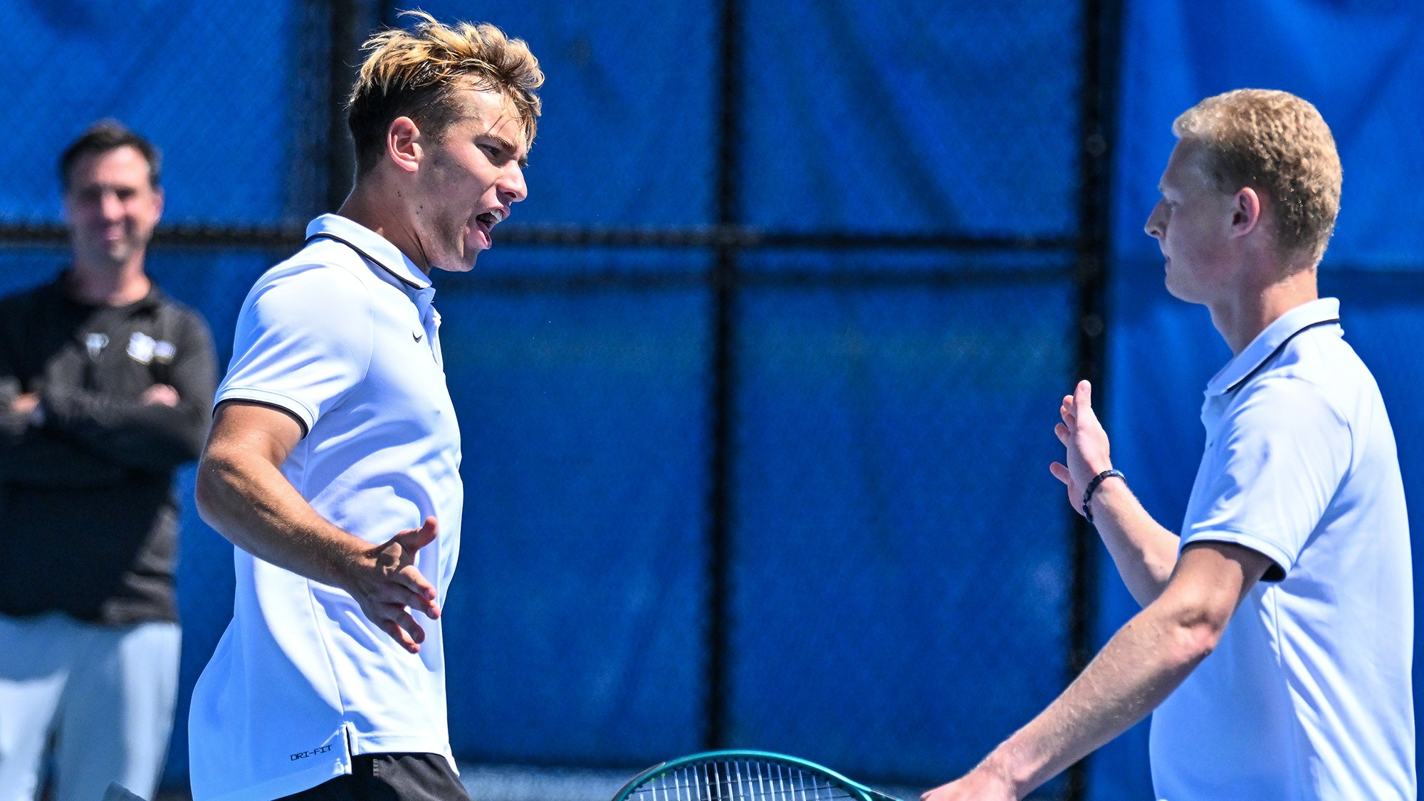 Men's Tennis doubles partners Alexei Katelevsky and Filip Moller congratulate each other after a point