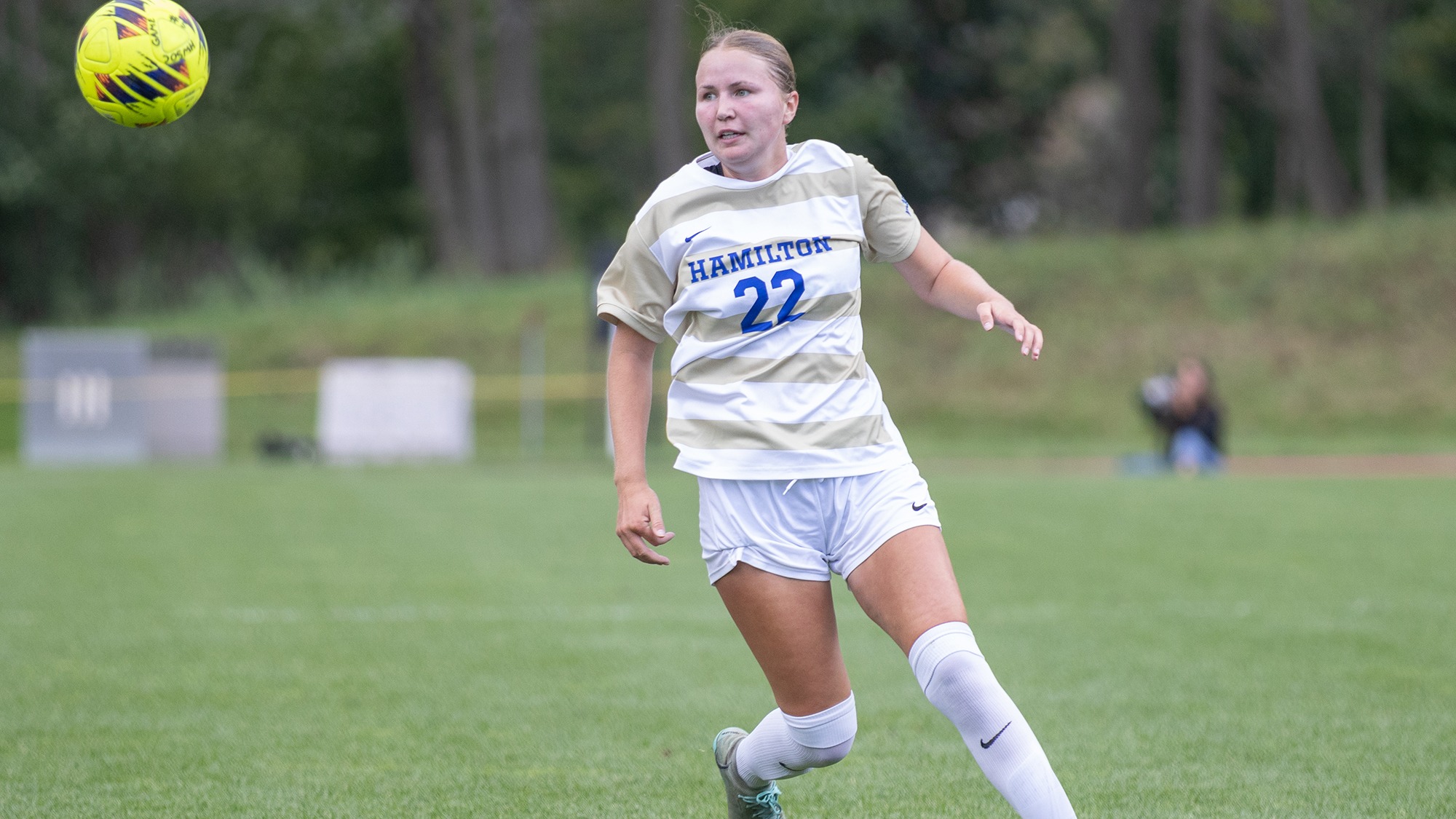 Lila Sullivan watches the soccer ball fly through the air towards her