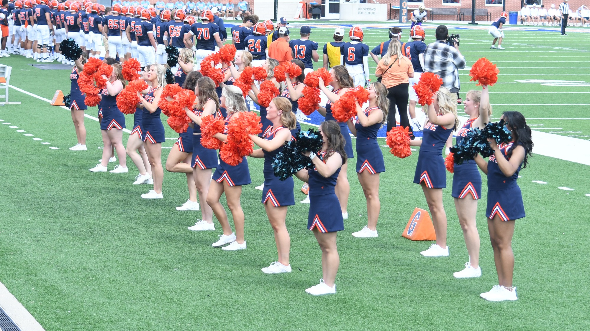 Hope College cheerleaders performing during a football game vs. Loras.