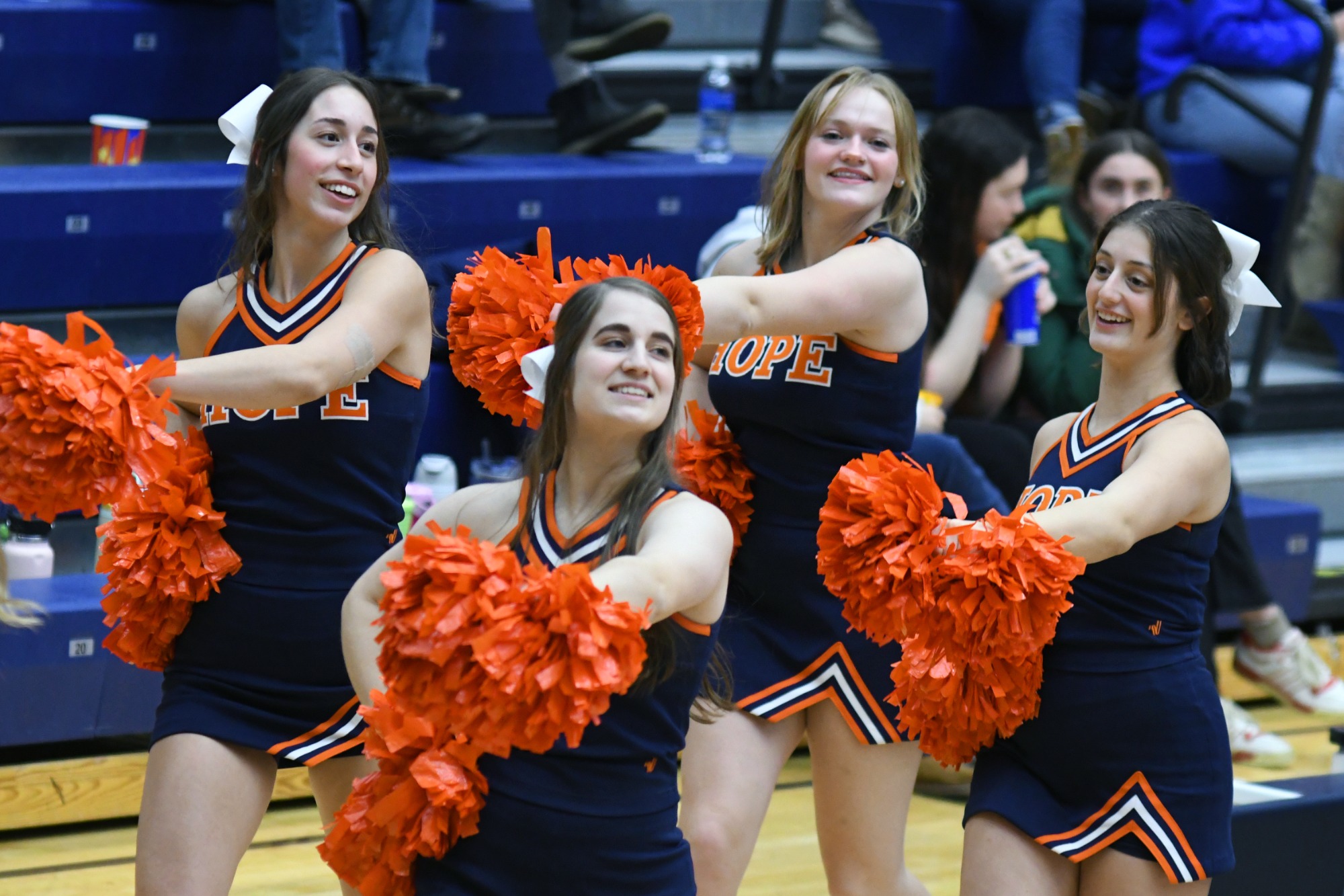 Hope College cheerleaders perform during the basketball season.