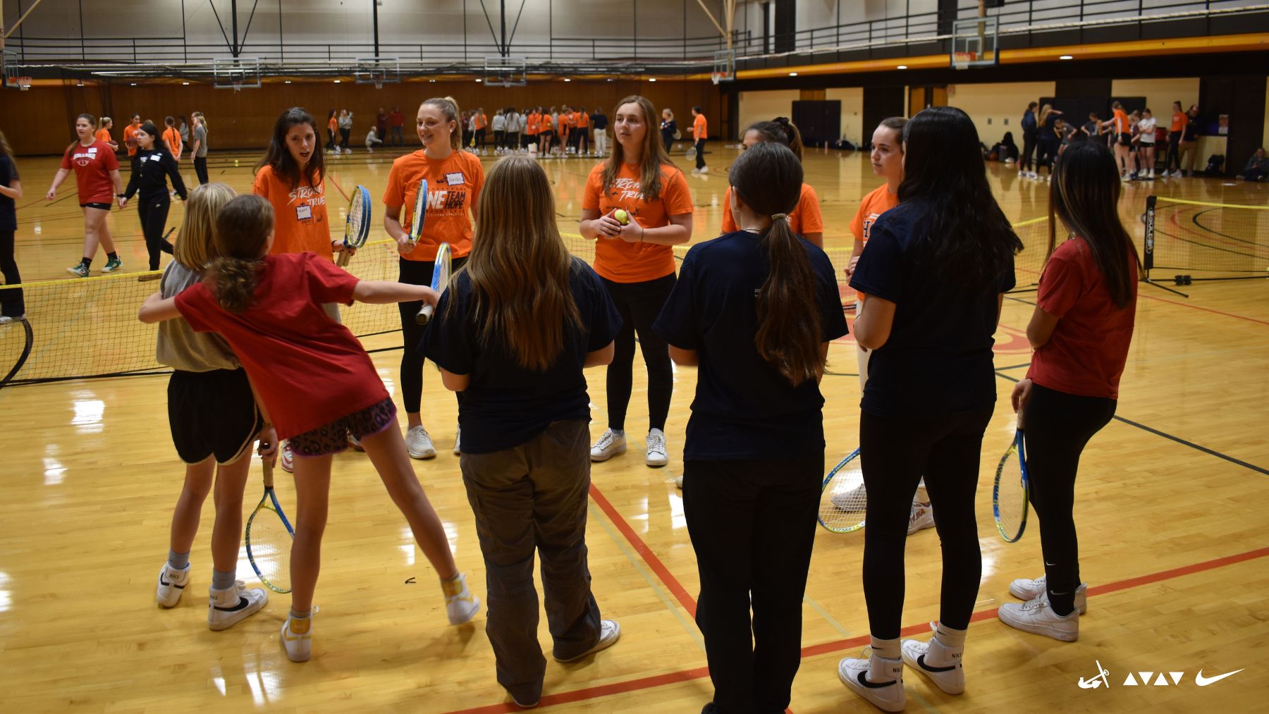 Participants in Hope's National Girls and Women in Sports Day event practice a sport together.