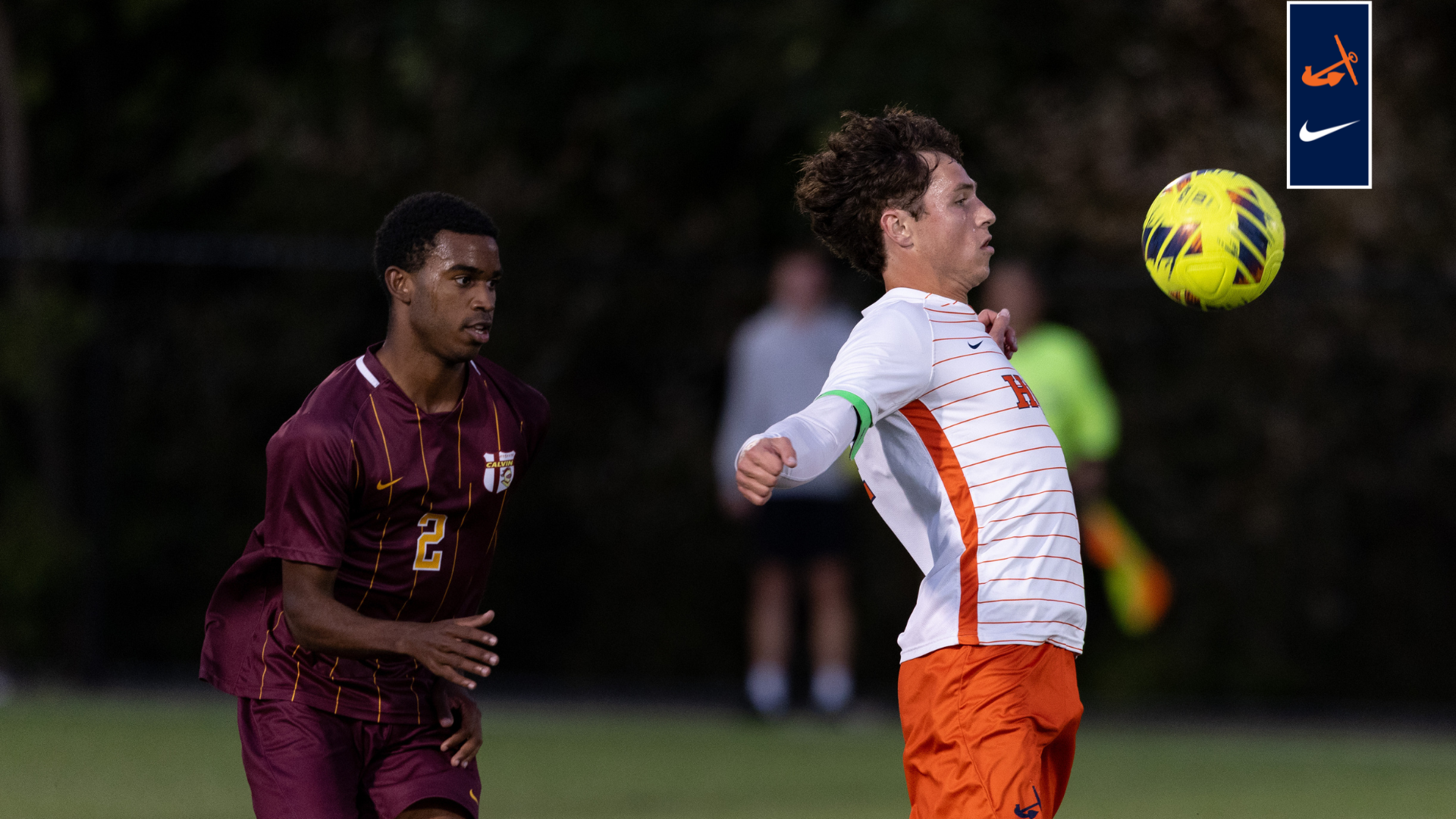 Seth Walters blocks the soccer ball with his chest.