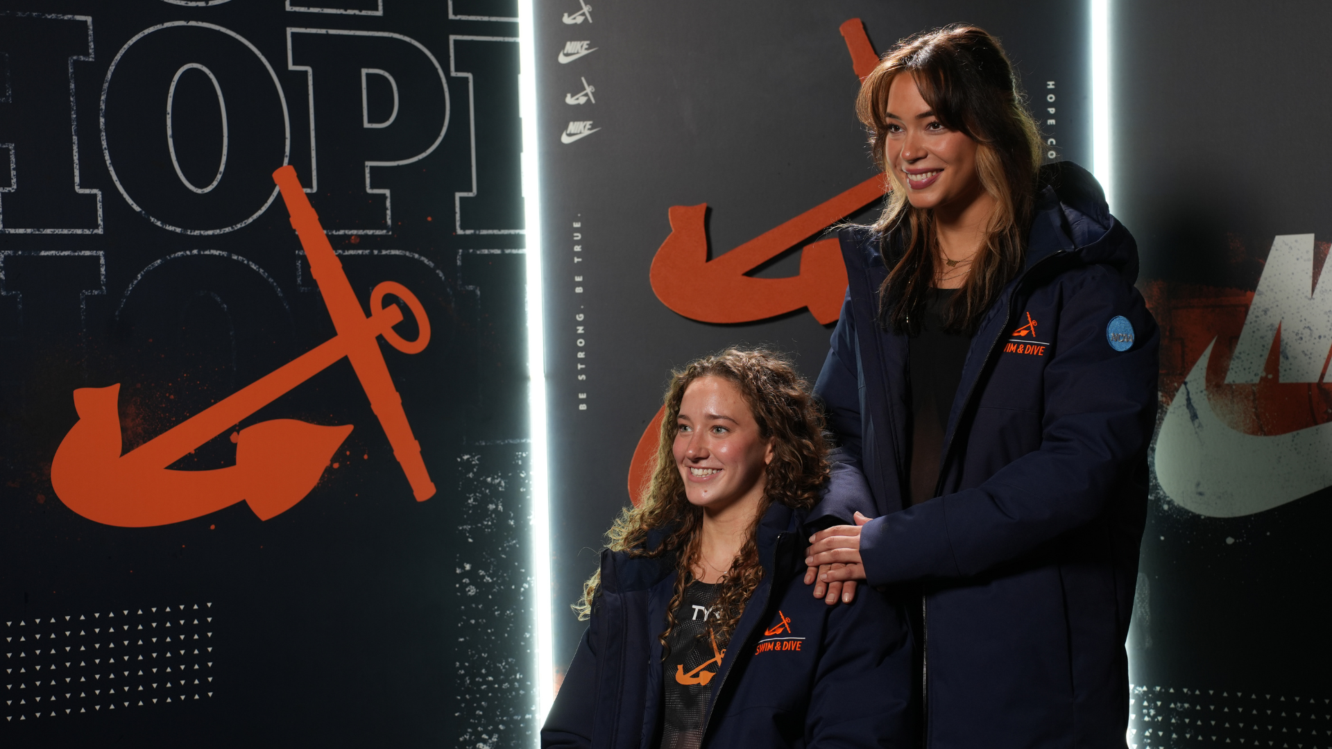 Swimmers Laurel Wasiniak and Bella Turner pose for a portrait.