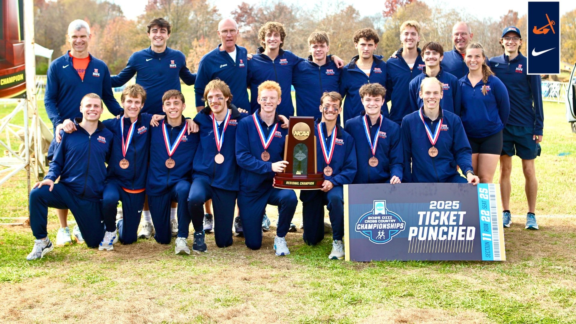The Hope College men's cross country team holds the NCAA regional trophy.