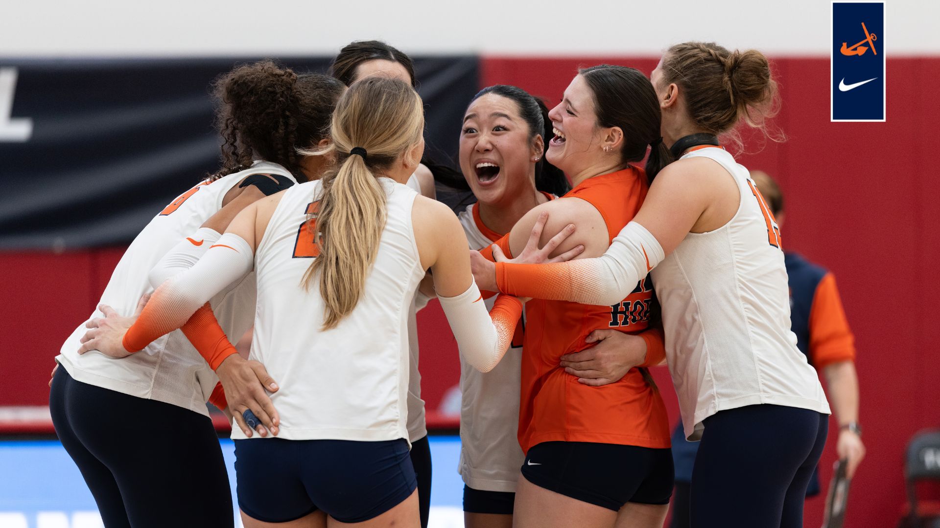 Hope volleyball players celebrate on the court.