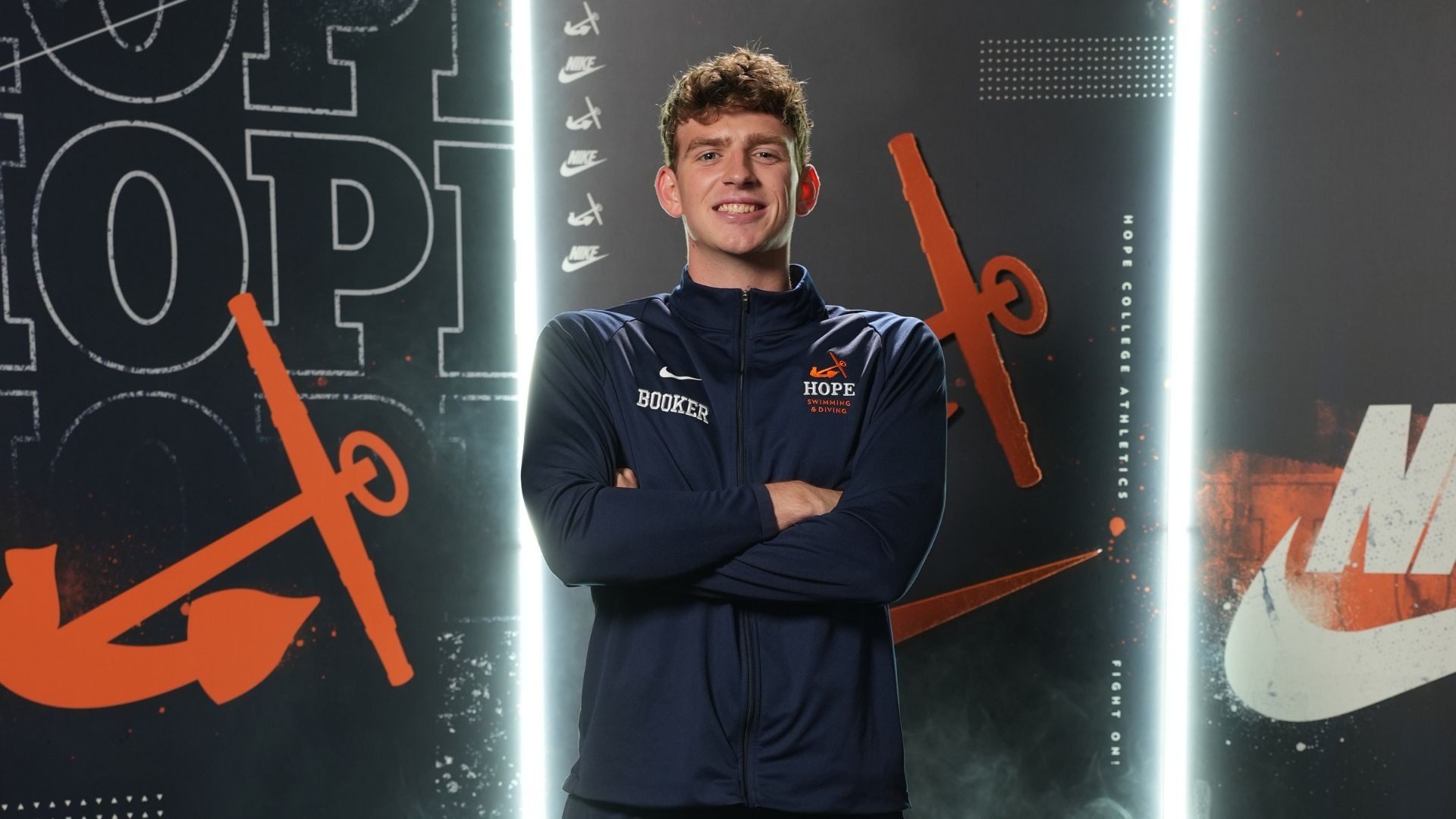 Swimmer Henry Booker poses for a portrait.