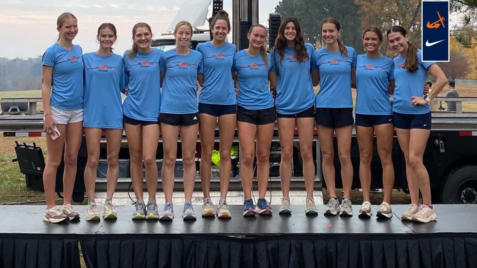 Seven Hope women's cross country runners pose together for a photo.