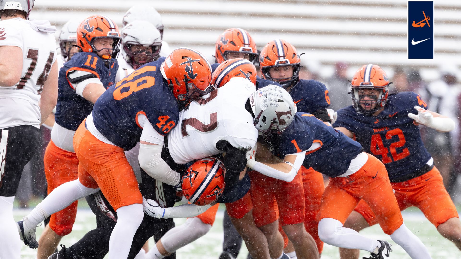 The Hope defense meets at the ballcarrier to make a tackle. 