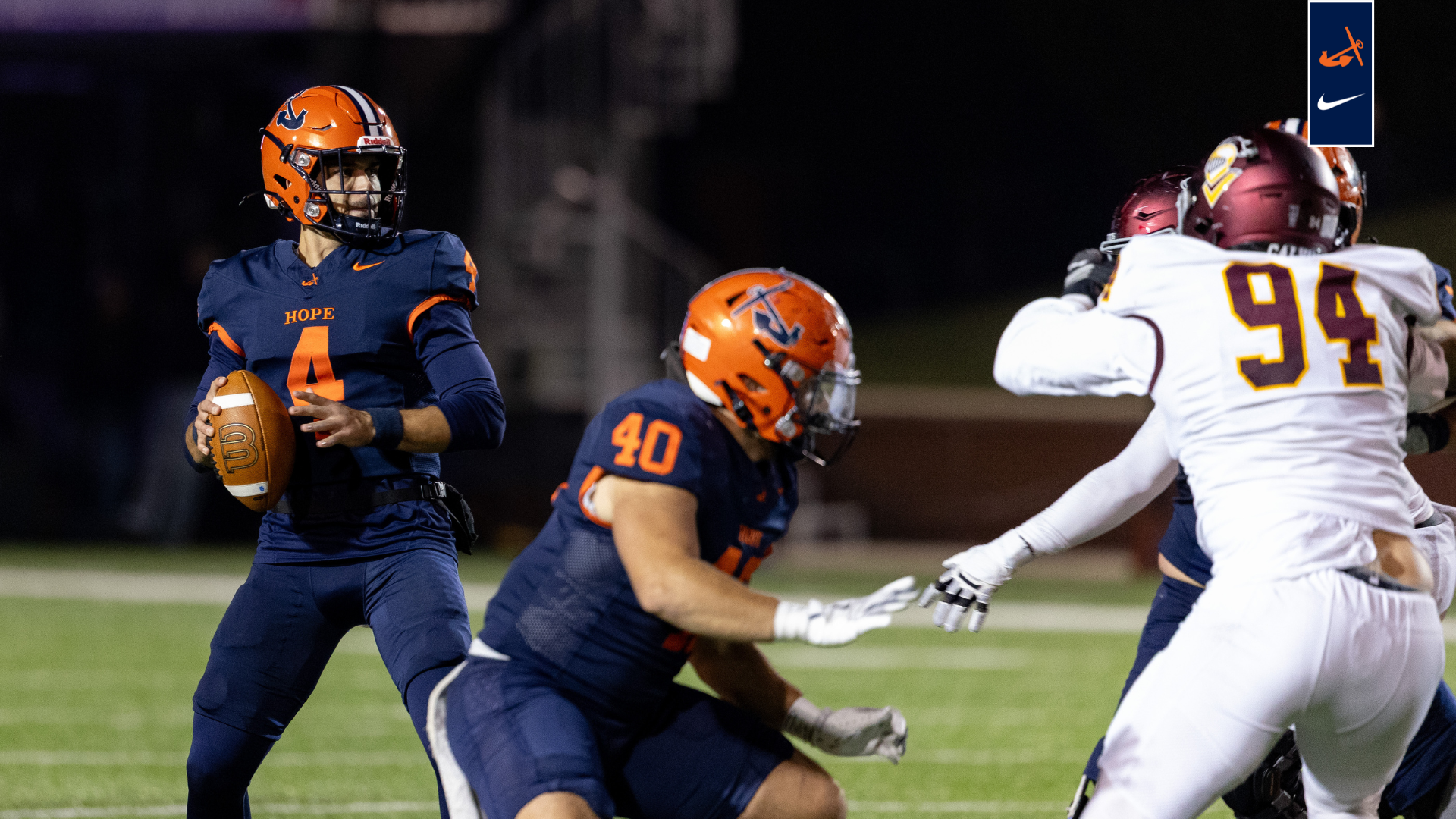 Quarterback Alex Thole looks where to throw a pass while Seth Luhmann blocks.