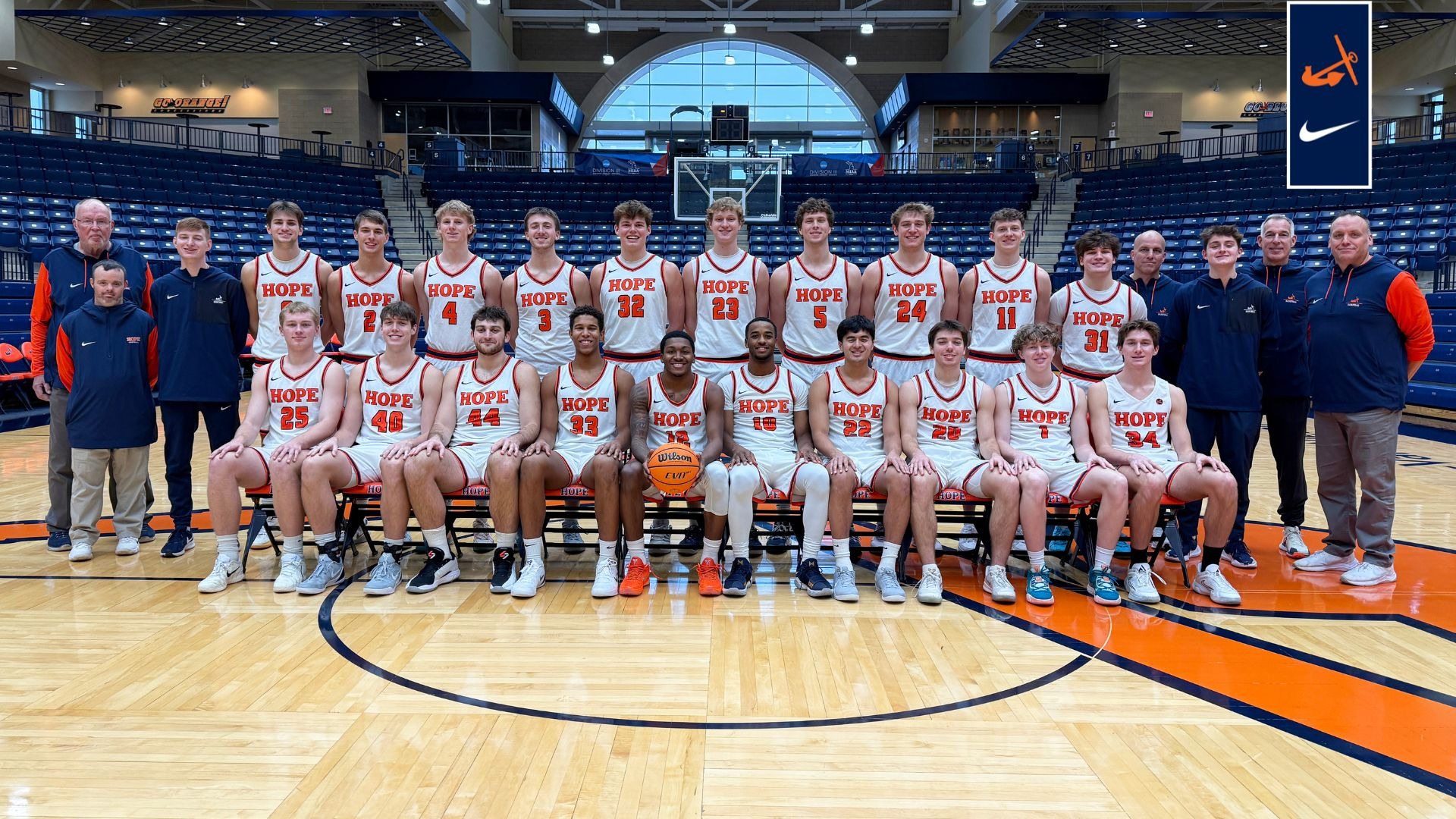 The 2025-26 Hope College men's basketball team poses for a group photo at midcourt.