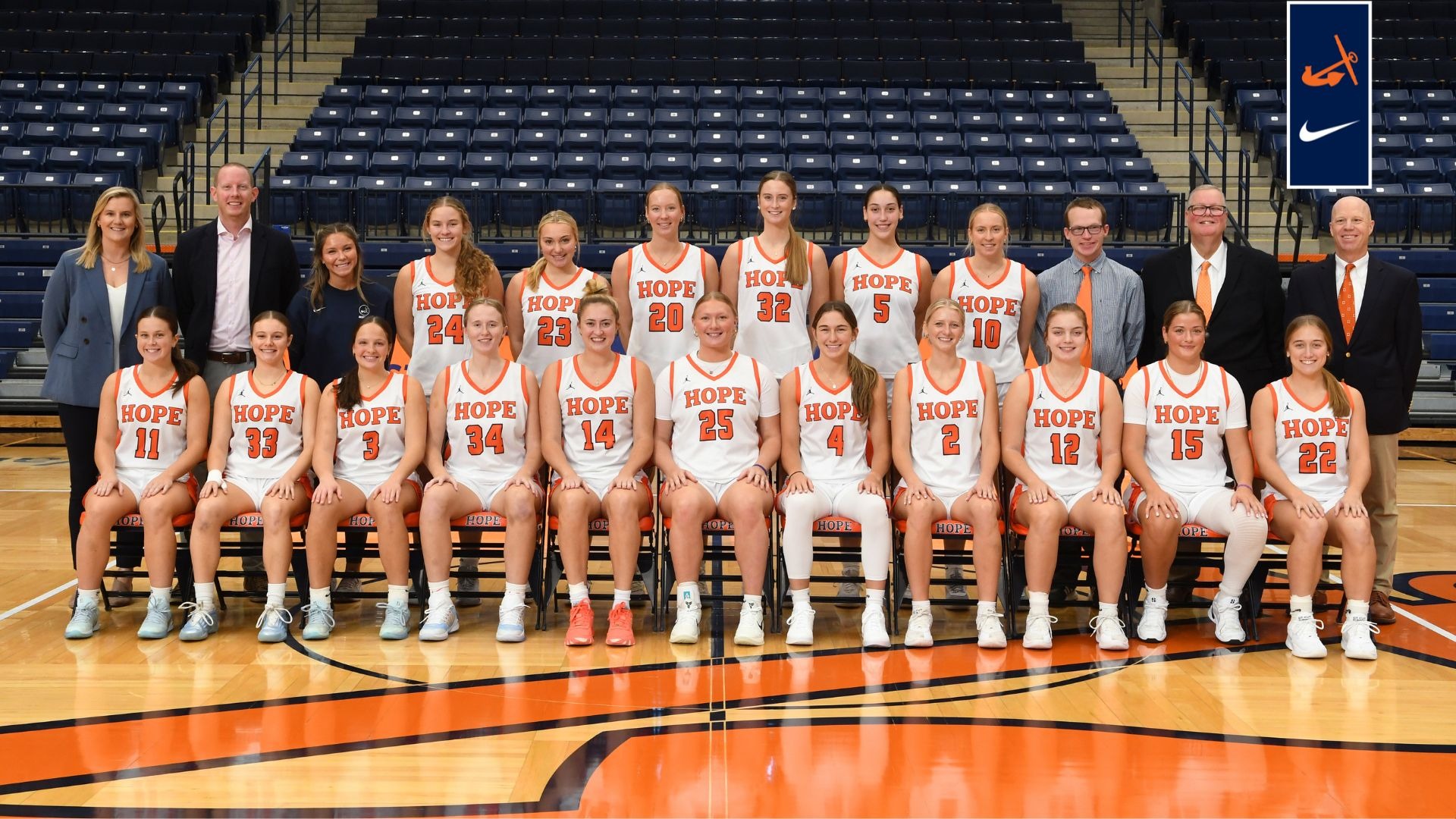 The Hope College women's basketball team pose for a group photo on the court at DeVos Fieldhouse.