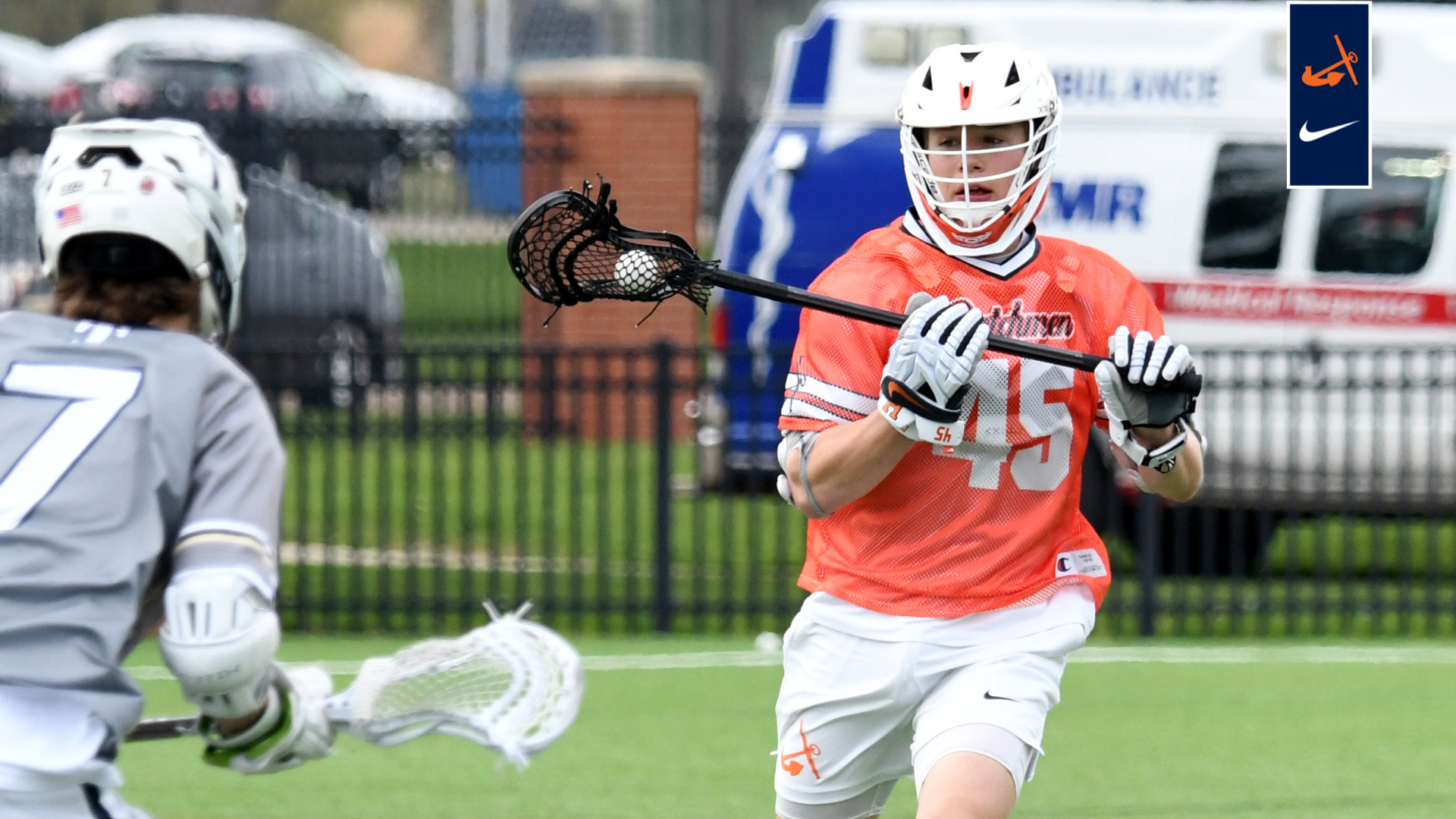 Owen Mueller runs the lacrosse ball up field.