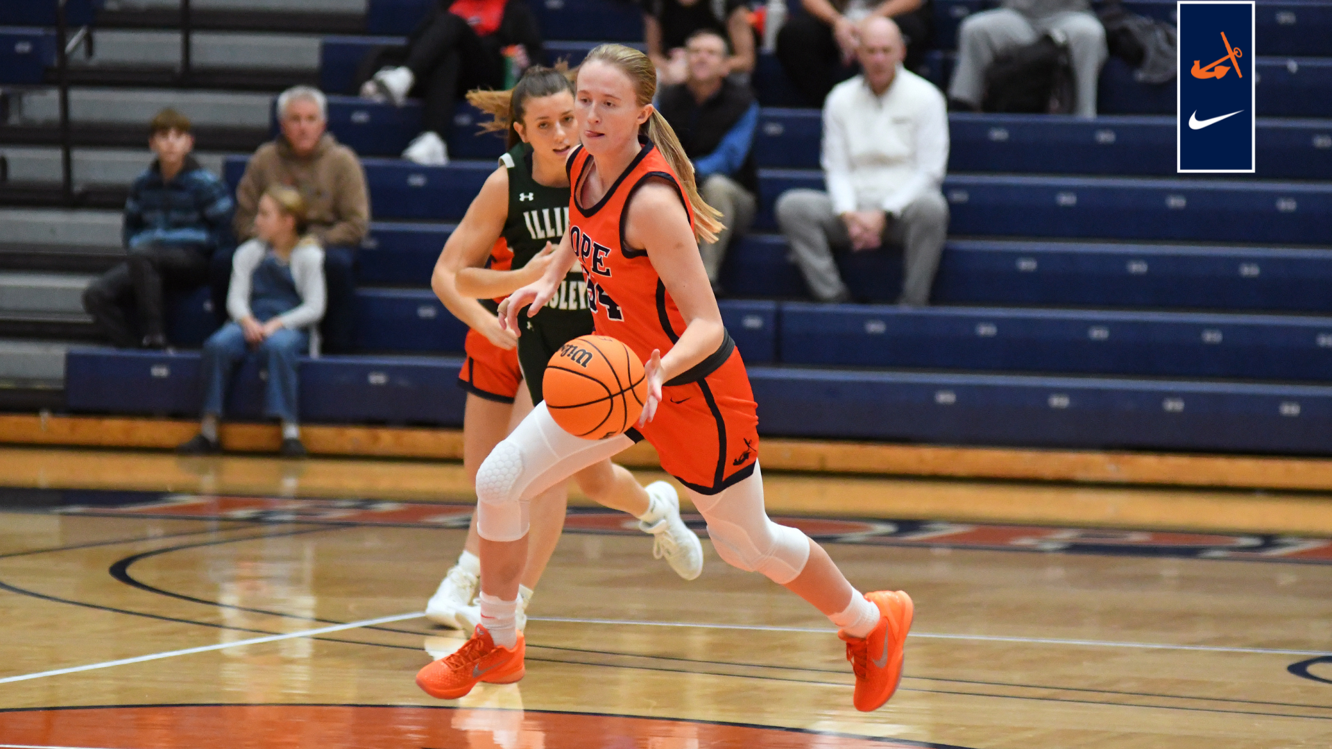 Maddie Petroelje runs the ball up the court