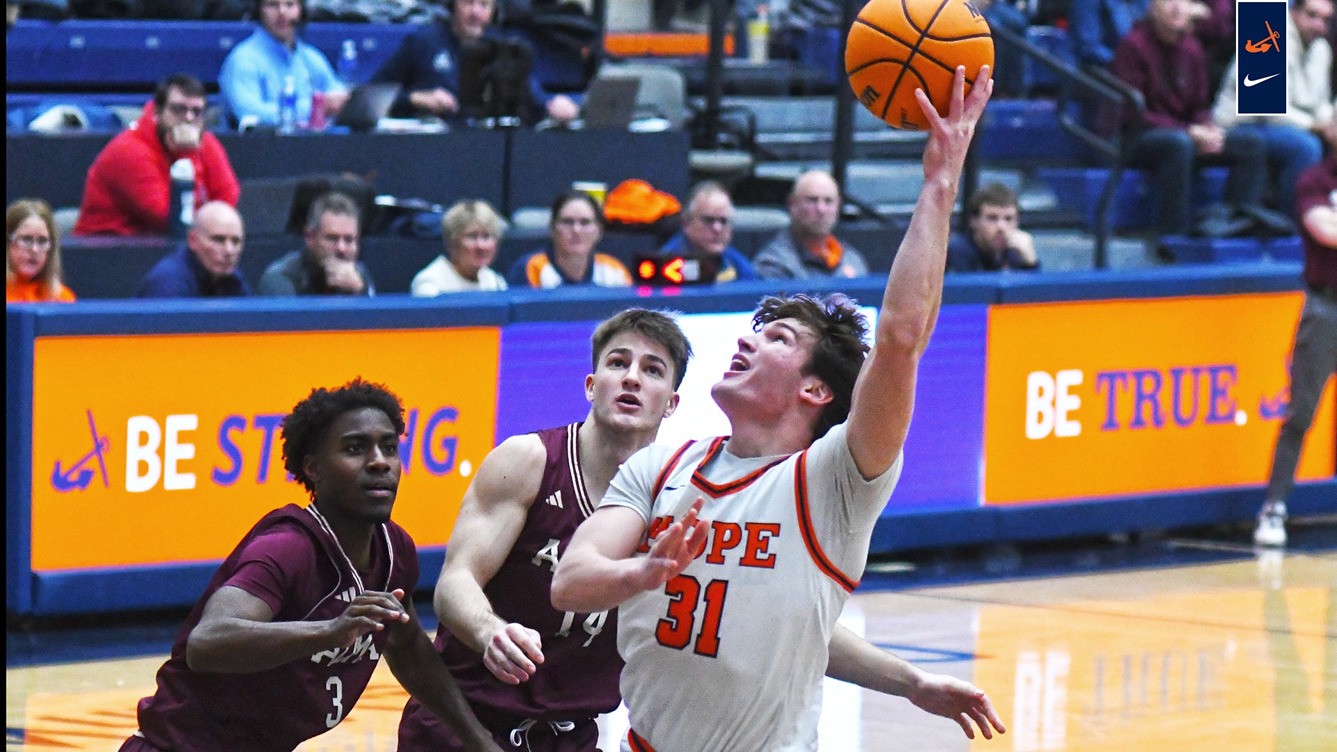 Brendan Cargill shoots a hook shot vs. Alma.