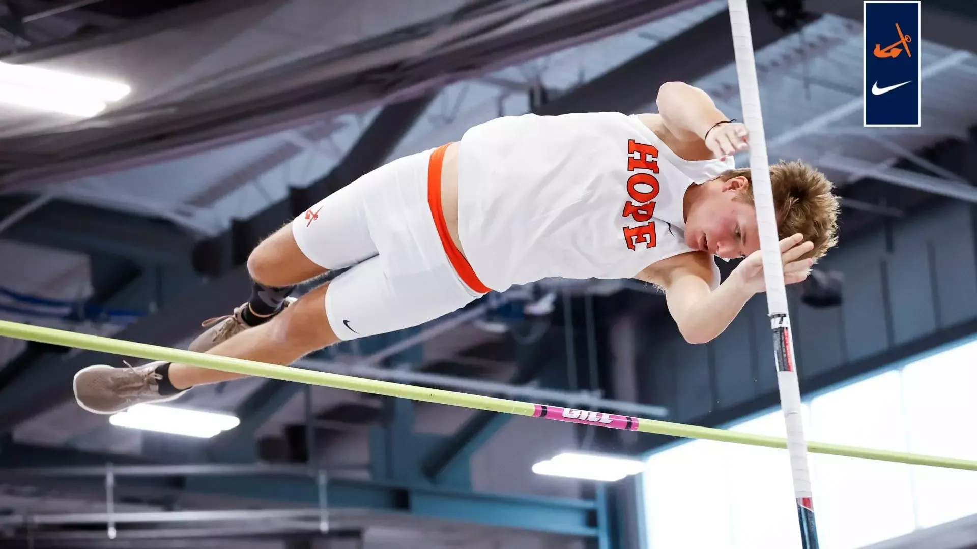 A Hope pole vaulter clears the bar during the Aurora Grand Prix.
