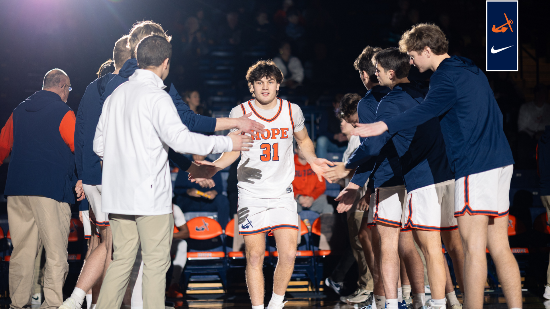 Brendan Cargill high fives teammates during the starting lineups