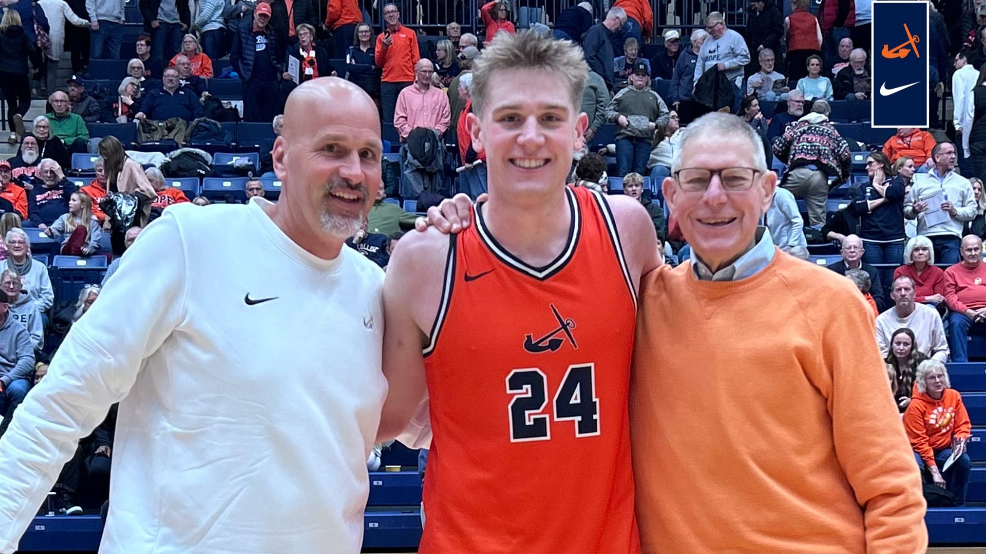 Hope forward Parker Hovey stands between Tim Schoonveld, left, and Glenn Van Wieren on the court at DeVos Fieldhouse.