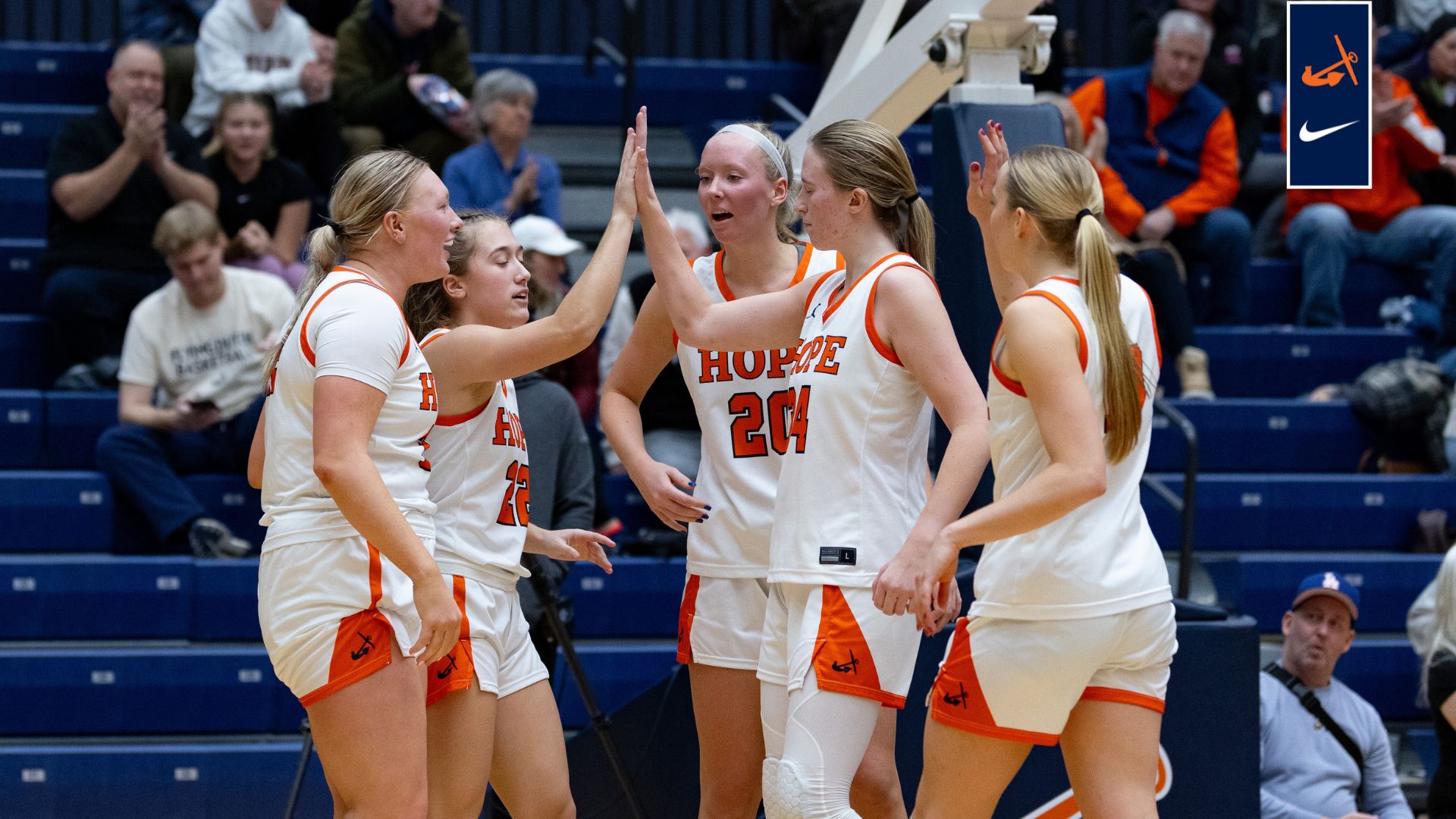 Five Hope players celebrate on the court.
