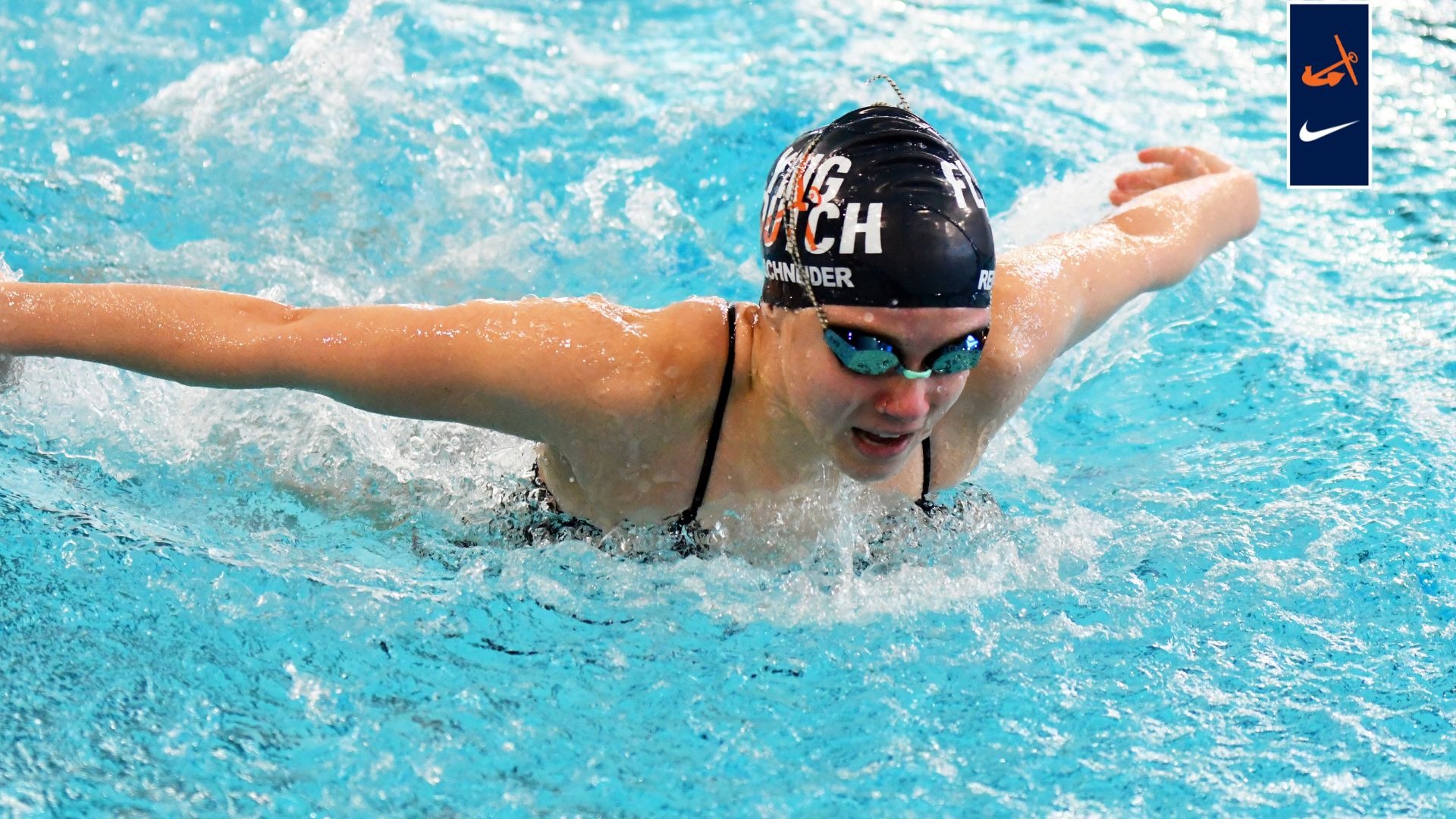 Madi Remenschneider swims vs. Calvin.