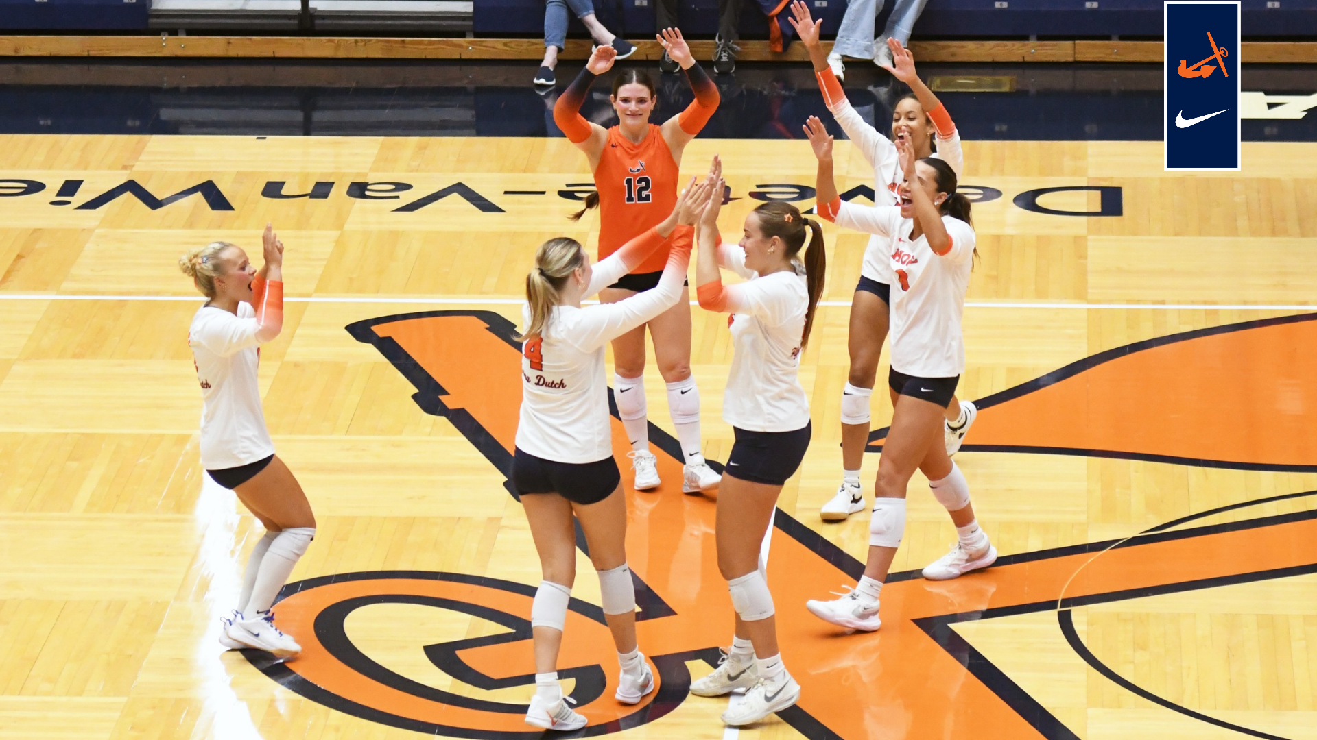 The volleyball team celebrates a point