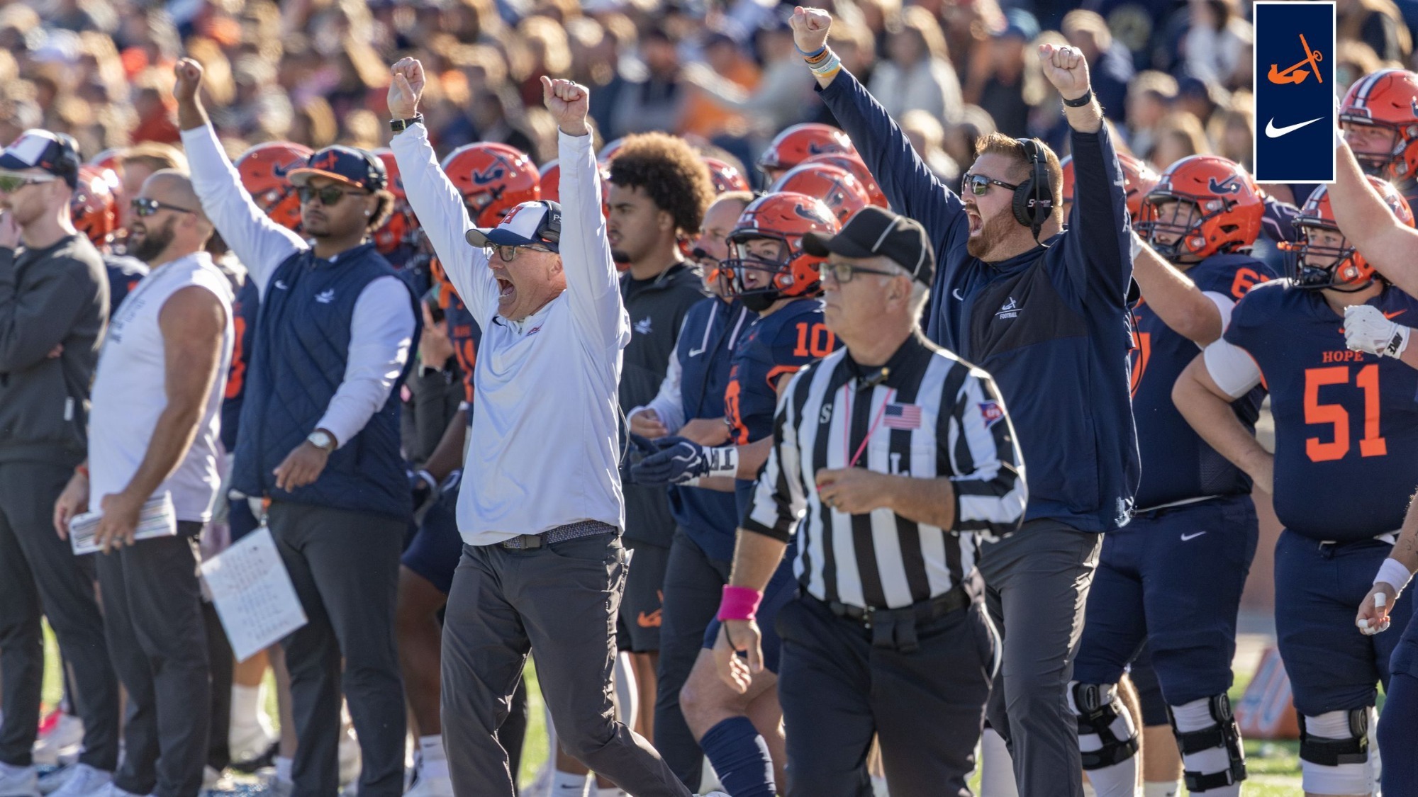 Hope football sidelines cheers after a big play.