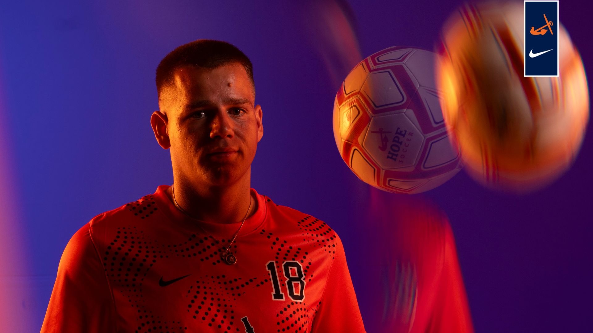 Evan Tsandes flips a soccer ball in the air.