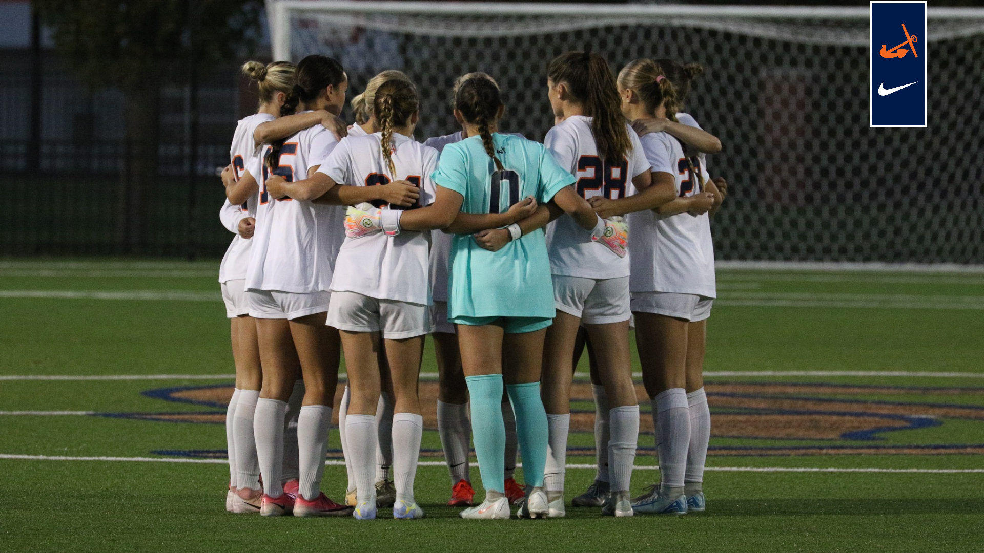 The women's soccer team huddles before the game