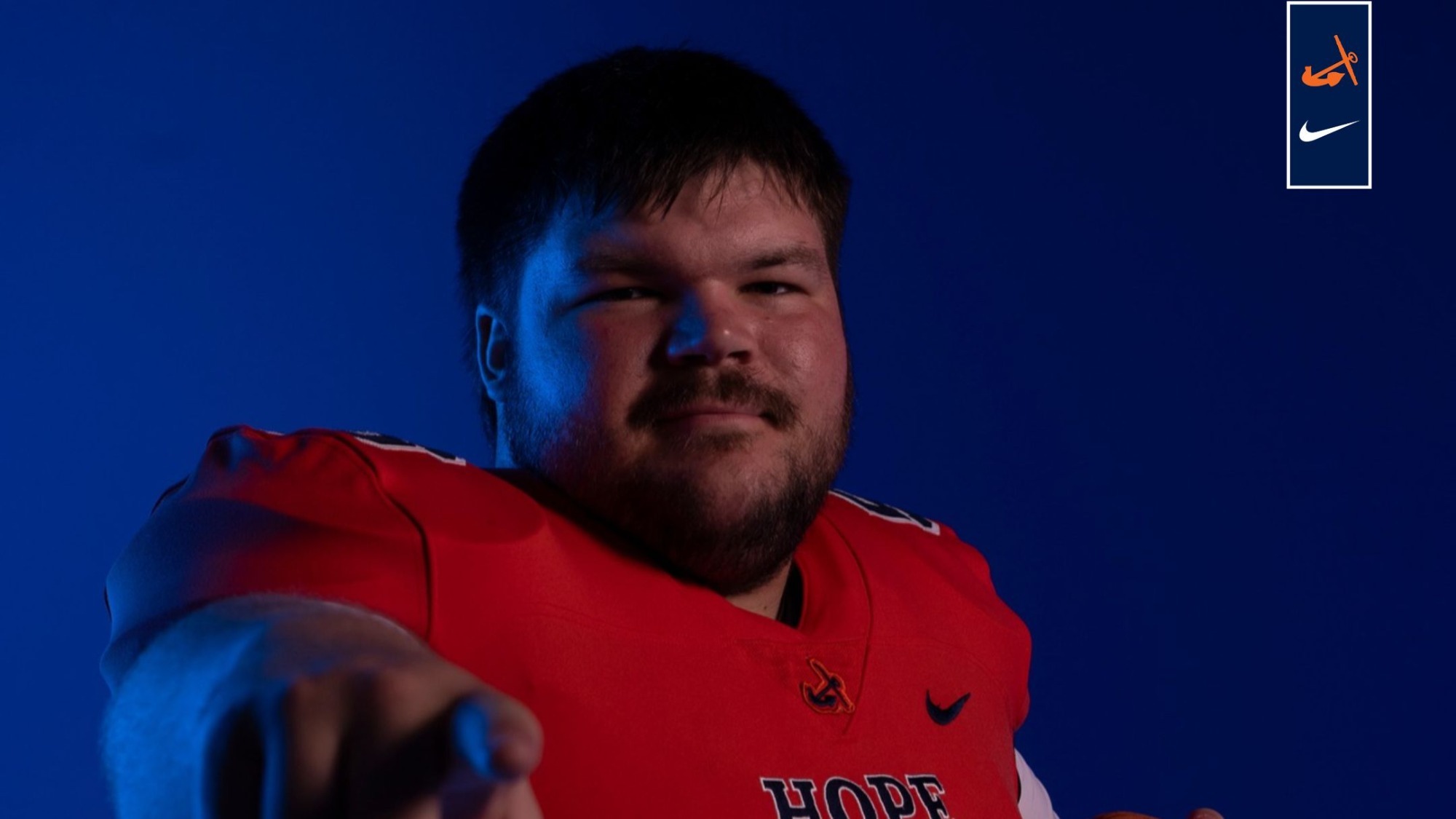 Kemper Millis holds a football.