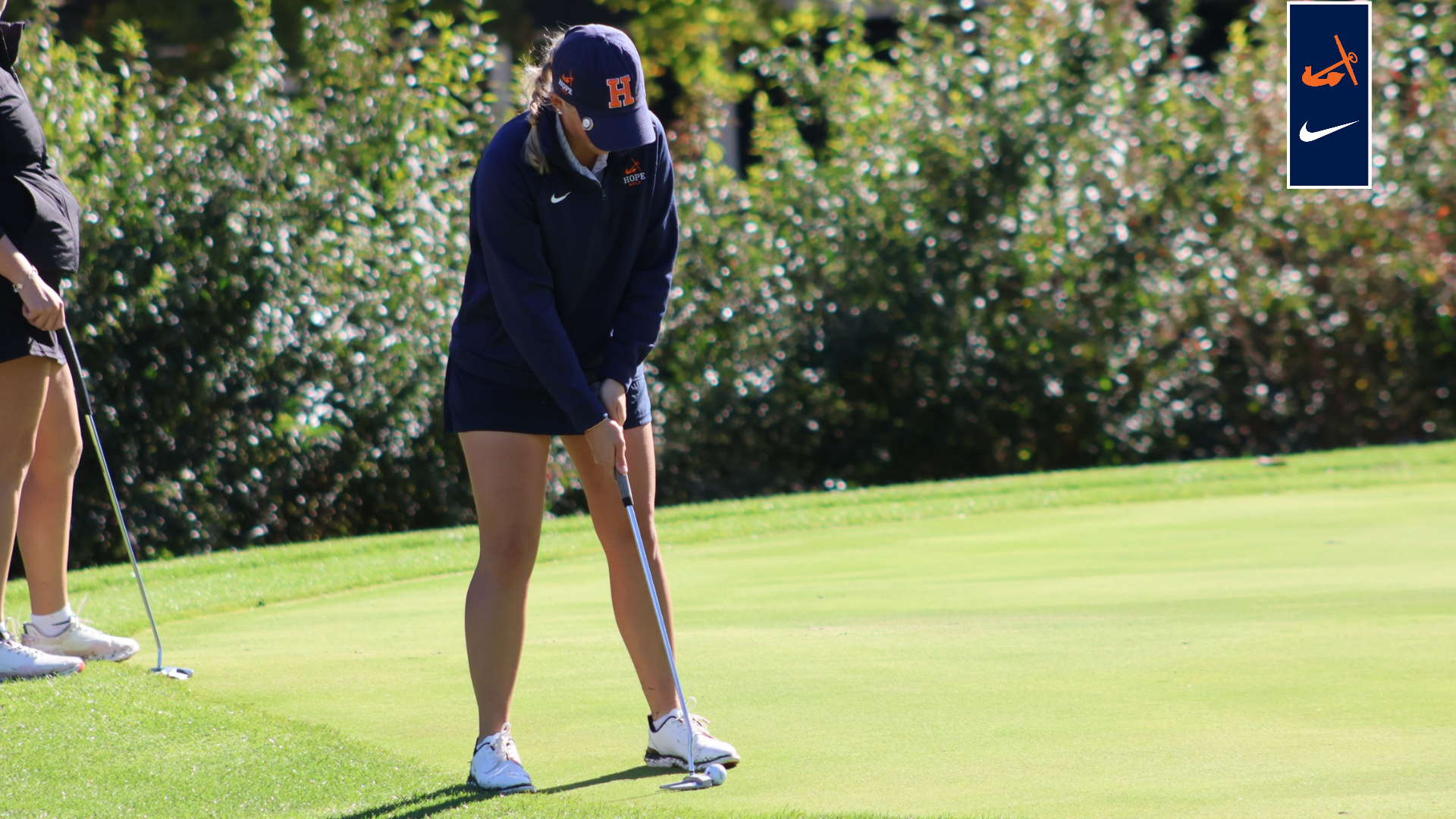 A golfer takes a swing