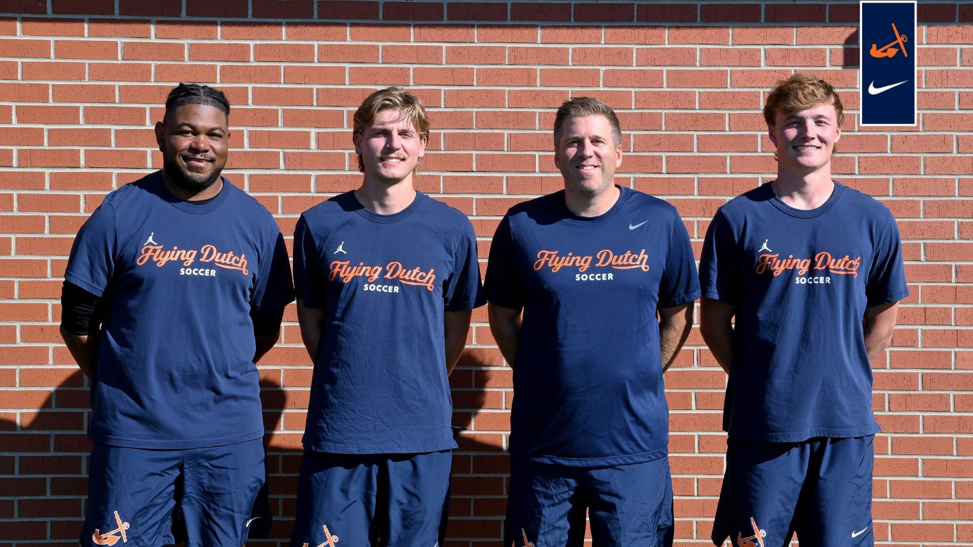 Four Hope College men's soccer coaches pose for a group photo.